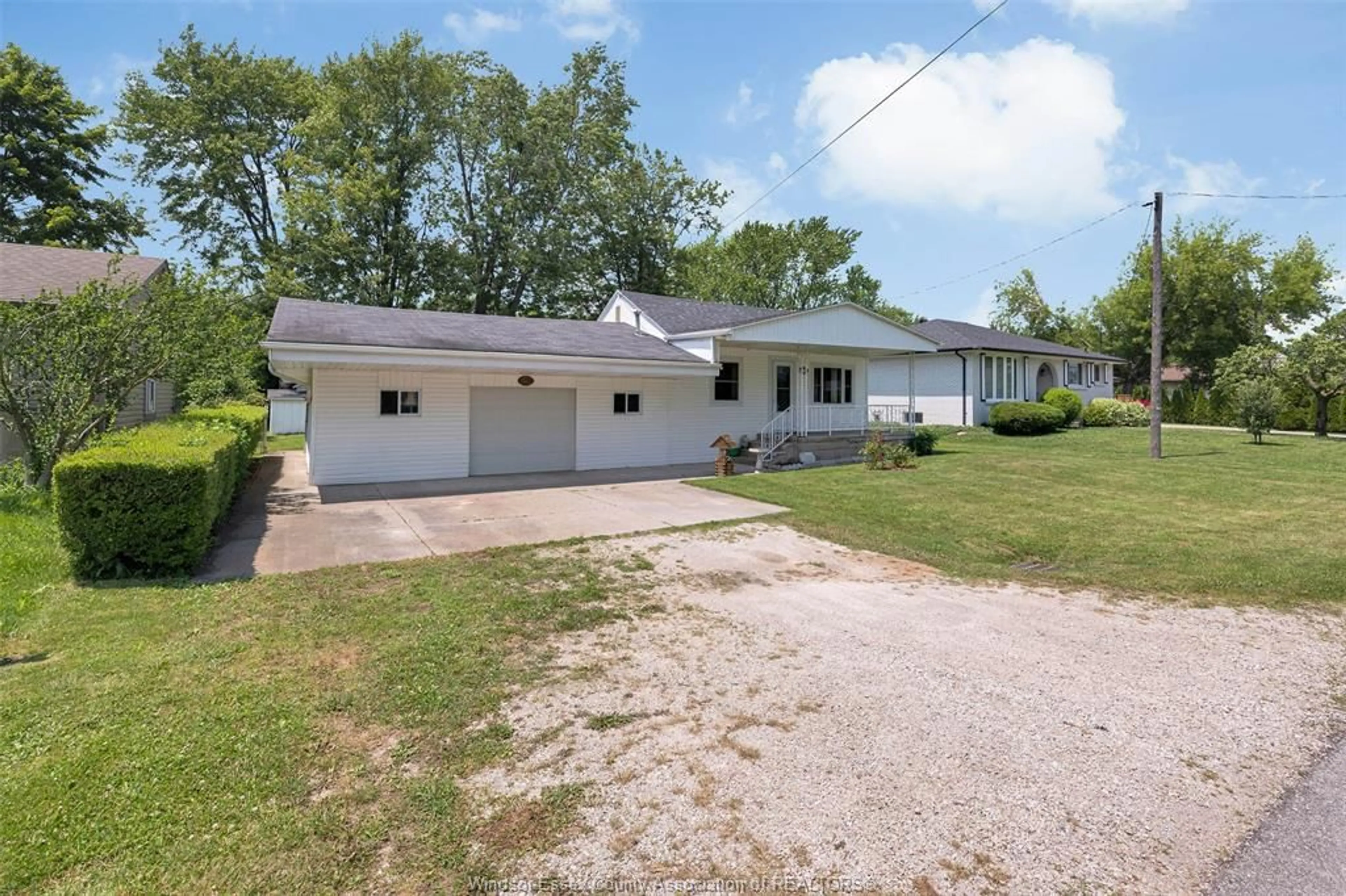 A pic from outside/outdoor area/front of a property/back of a property/a pic from drone, street for 211 DUBOIS Ave, Lakeshore Ontario N0R 1C0