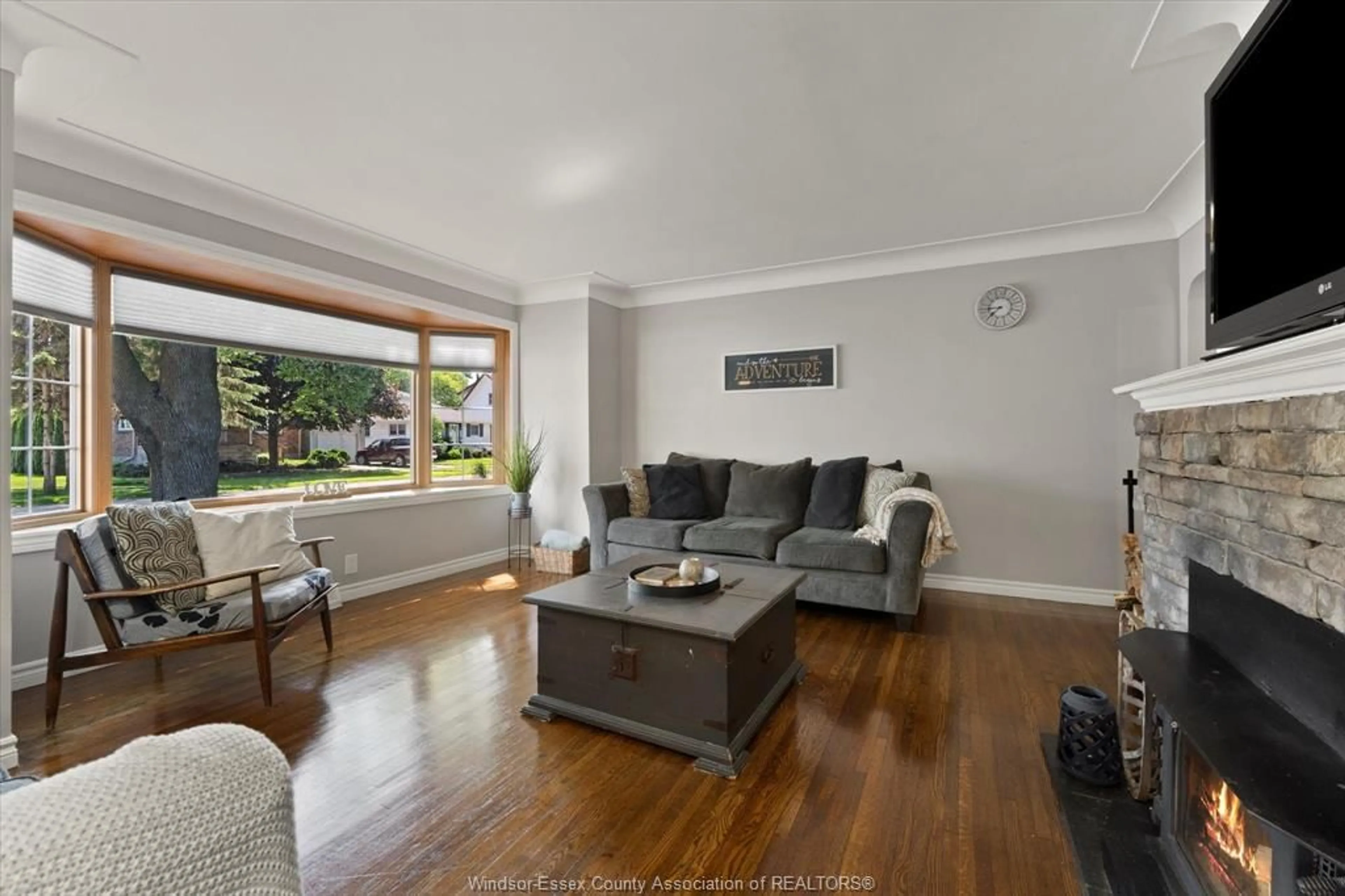 Living room with furniture, wood/laminate floor for 469 John M St, Windsor Ontario N8P 1C1