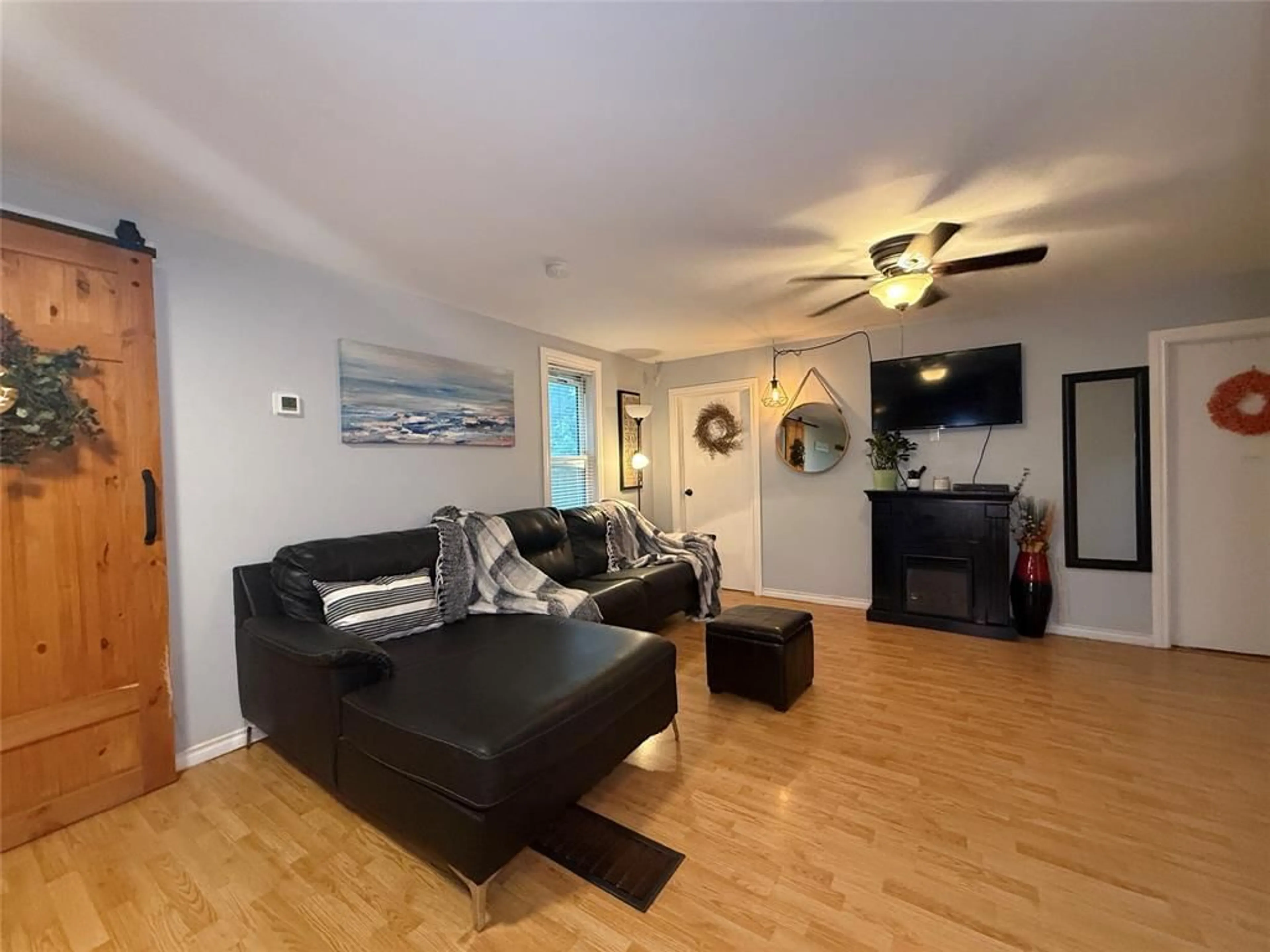 Living room with furniture, wood/laminate floor for 4361 FIFTH St, Petrolia Ontario N0N 1R0
