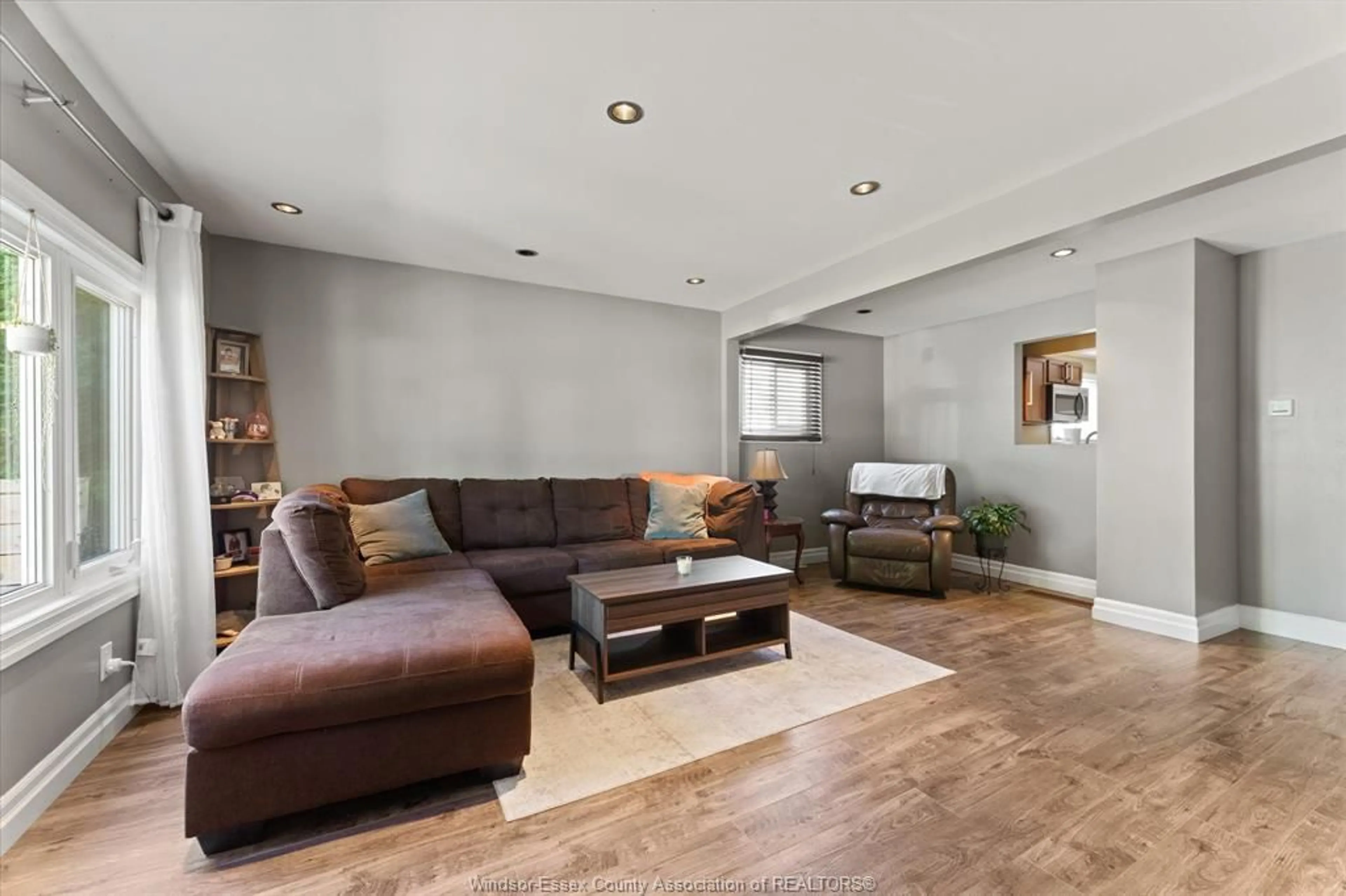 Living room with furniture, wood/laminate floor for 2382 Elsmere, Windsor Ontario N8W 2C8