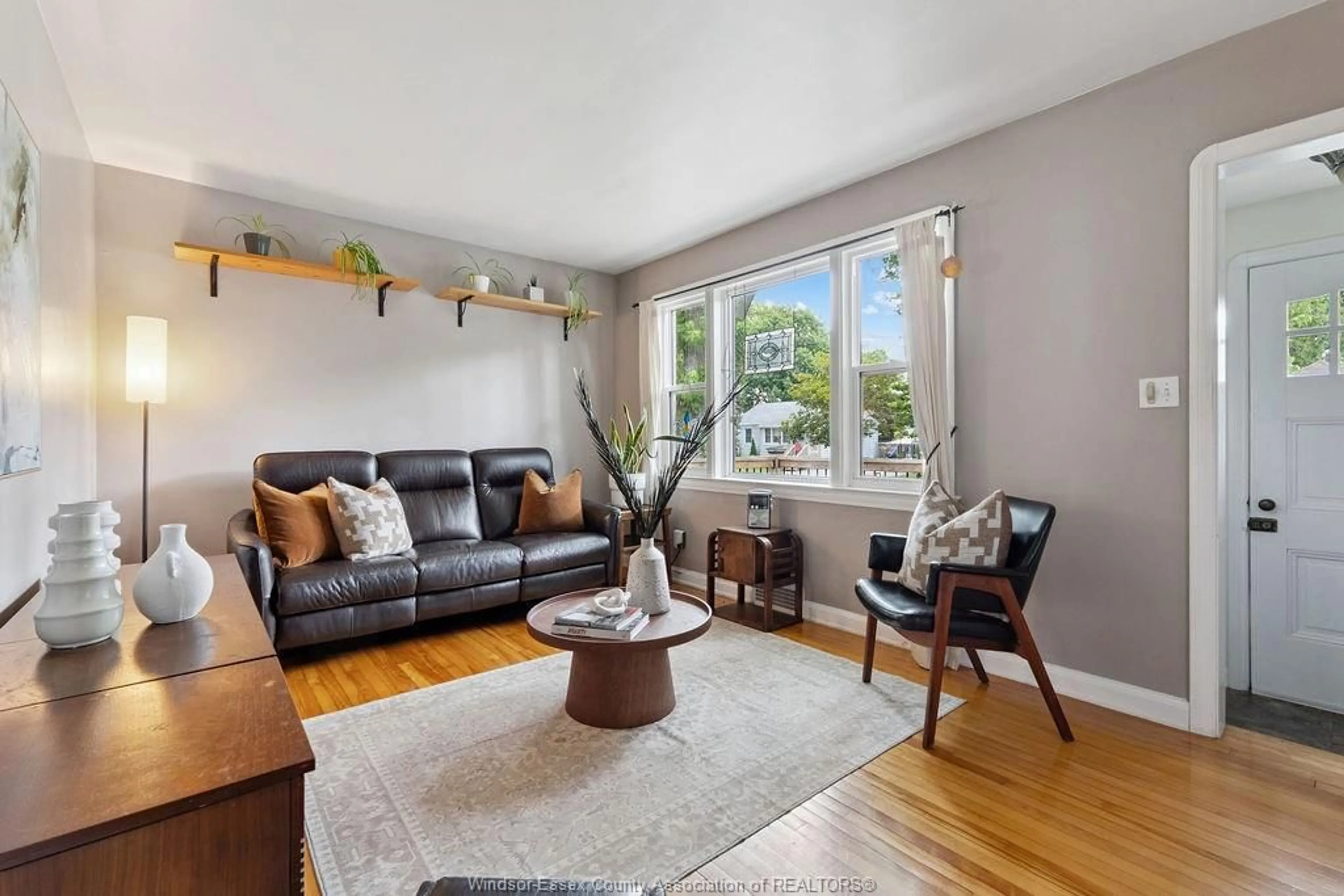 Living room with furniture, wood/laminate floor for 1953 Ellrose Ave, Windsor Ontario N8W 4V1