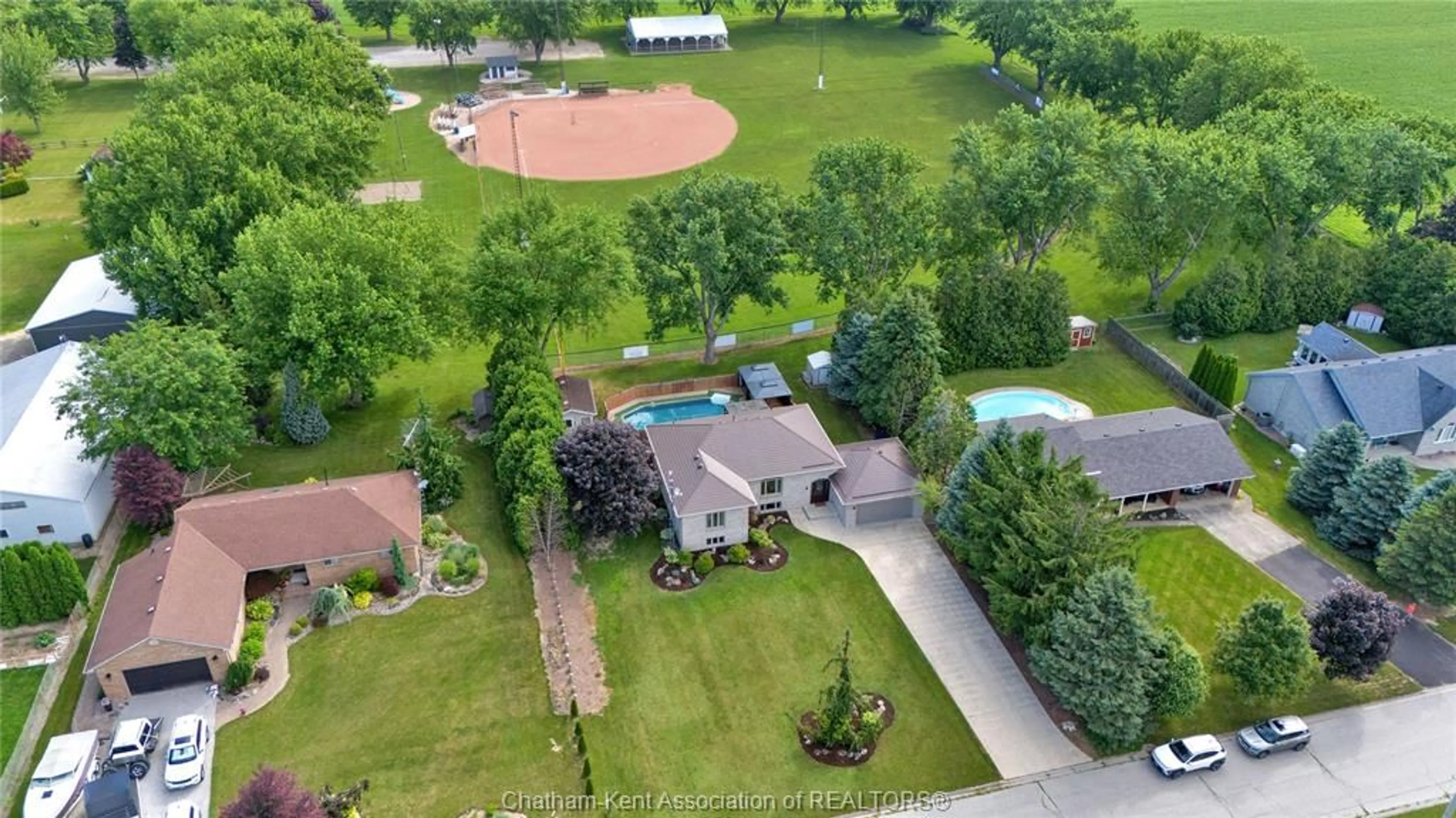 A pic from outside/outdoor area/front of a property/back of a property/a pic from drone, water/lake/river/ocean view for 25619 Meadowbrook Lane, Chatham-Kent Ontario N0P 1S0