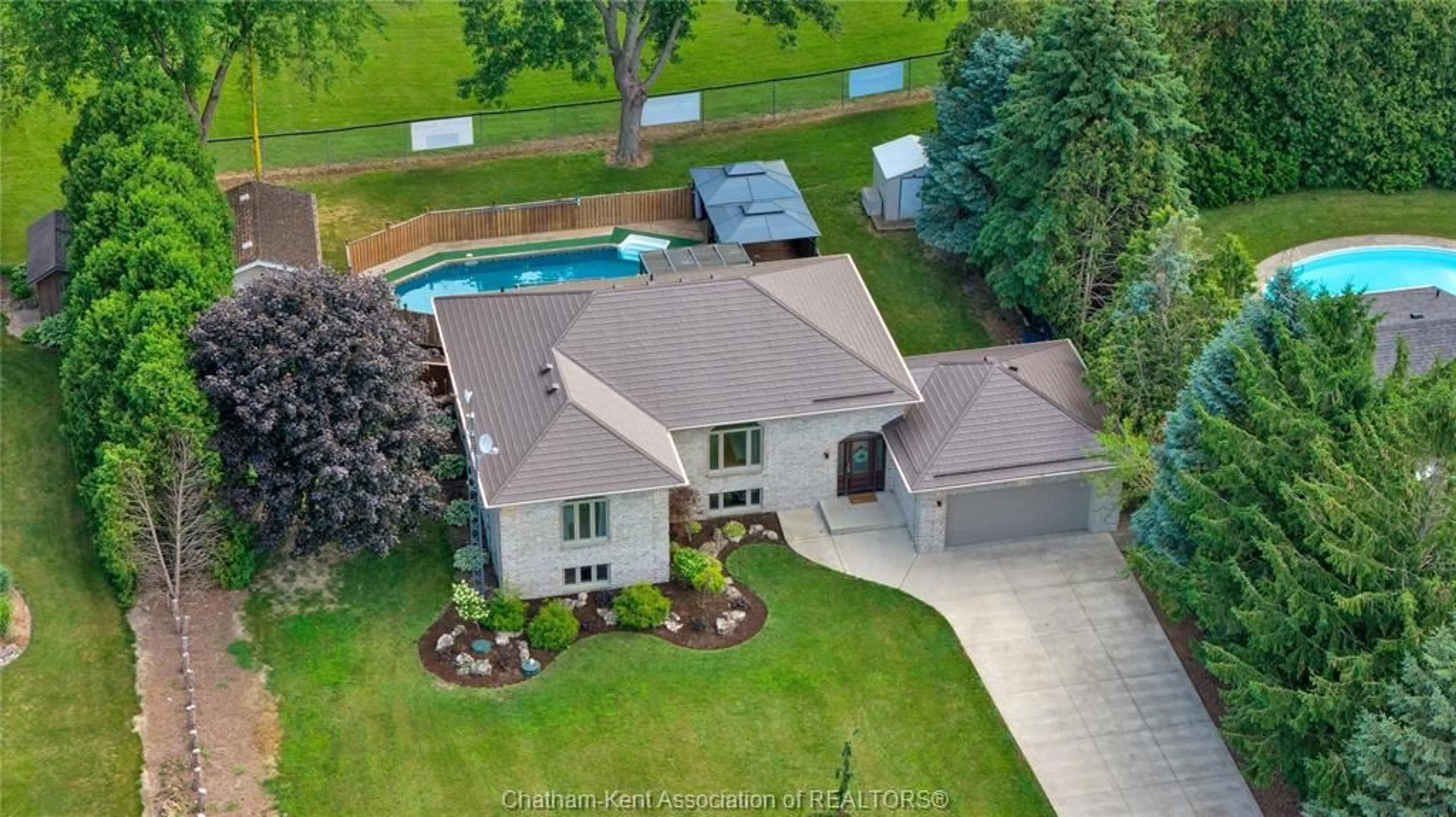 A pic from outside/outdoor area/front of a property/back of a property/a pic from drone, water/lake/river/ocean view for 25619 Meadowbrook Lane, Chatham-Kent Ontario N0P 1S0
