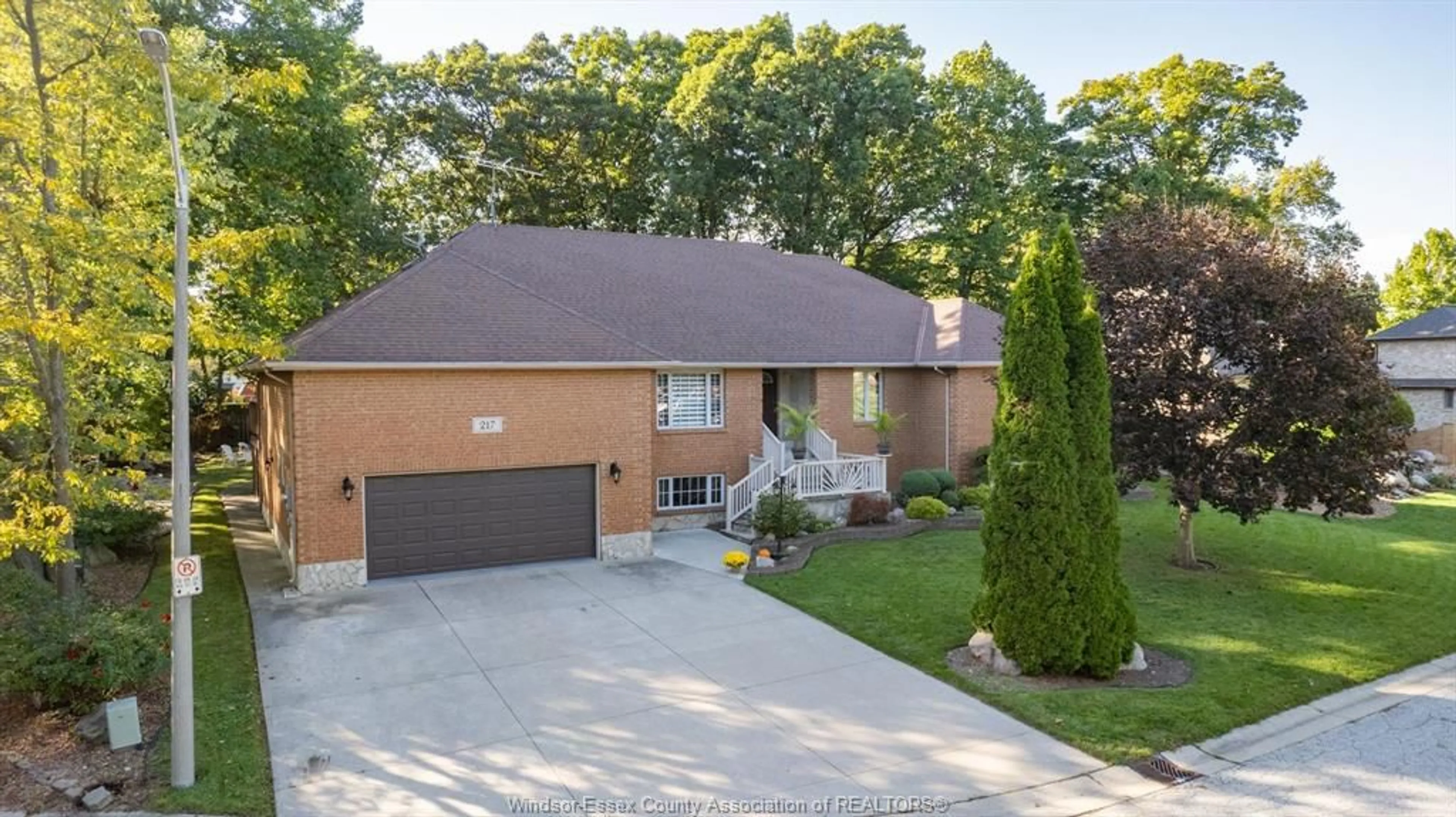 Home with brick exterior material, street for 217 WOODLAND Dr, Harrow Ontario N0R 1G0