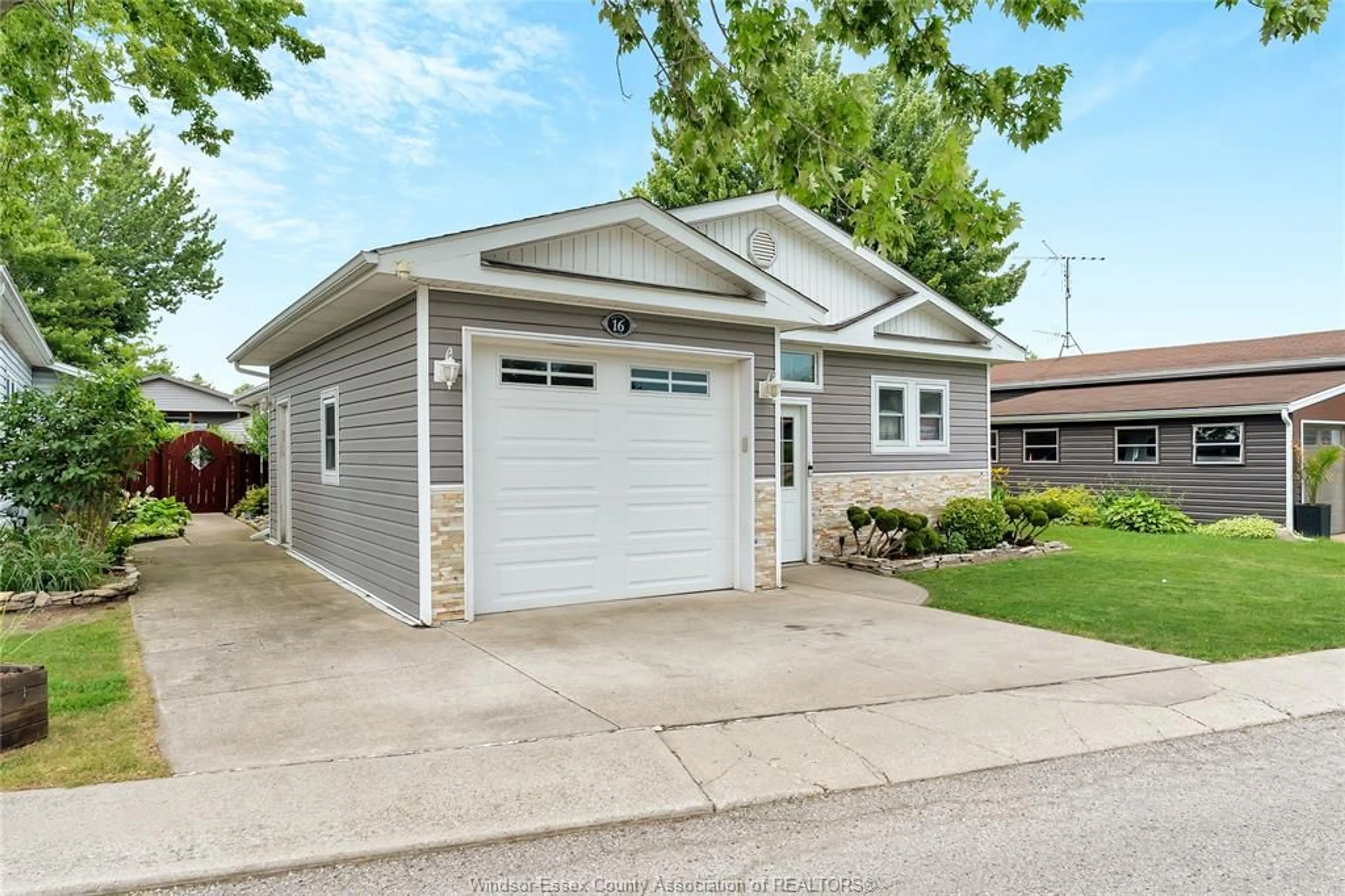 Home with vinyl exterior material, street for 16 MAGNOLIA, McGregor Ontario N0R 1J0