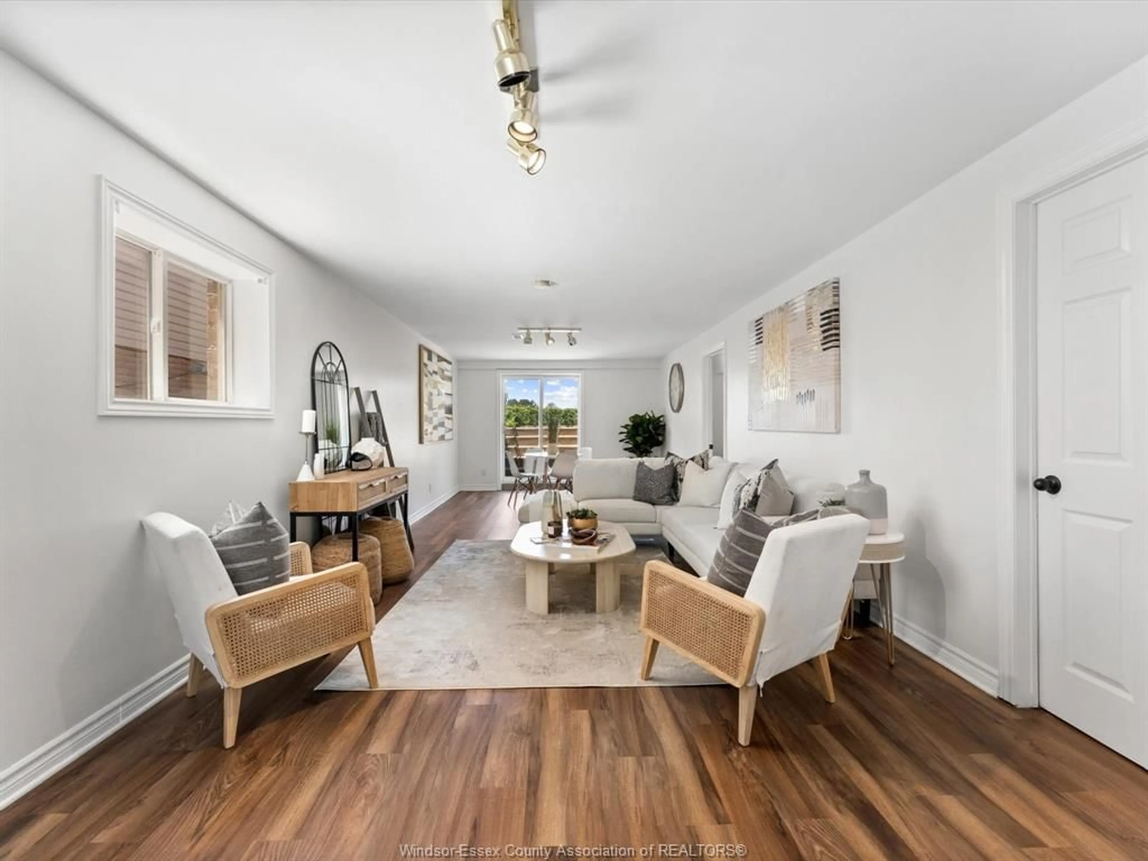 Living room with furniture, wood/laminate floor for 875 MICHAEL, Tecumseh Ontario N8N 5A2