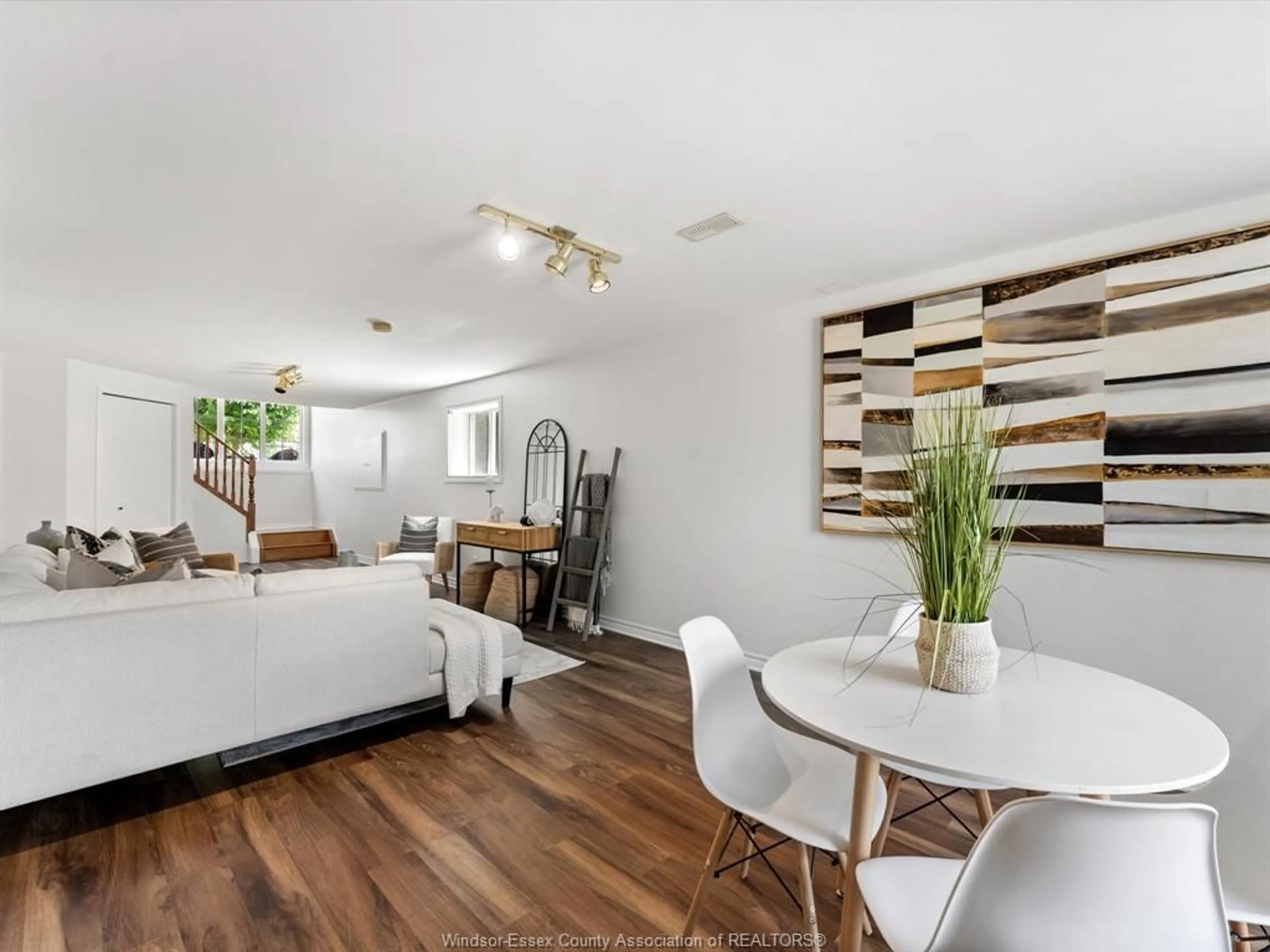 Living room with furniture, wood/laminate floor for 875 MICHAEL, Tecumseh Ontario N8N 5A2