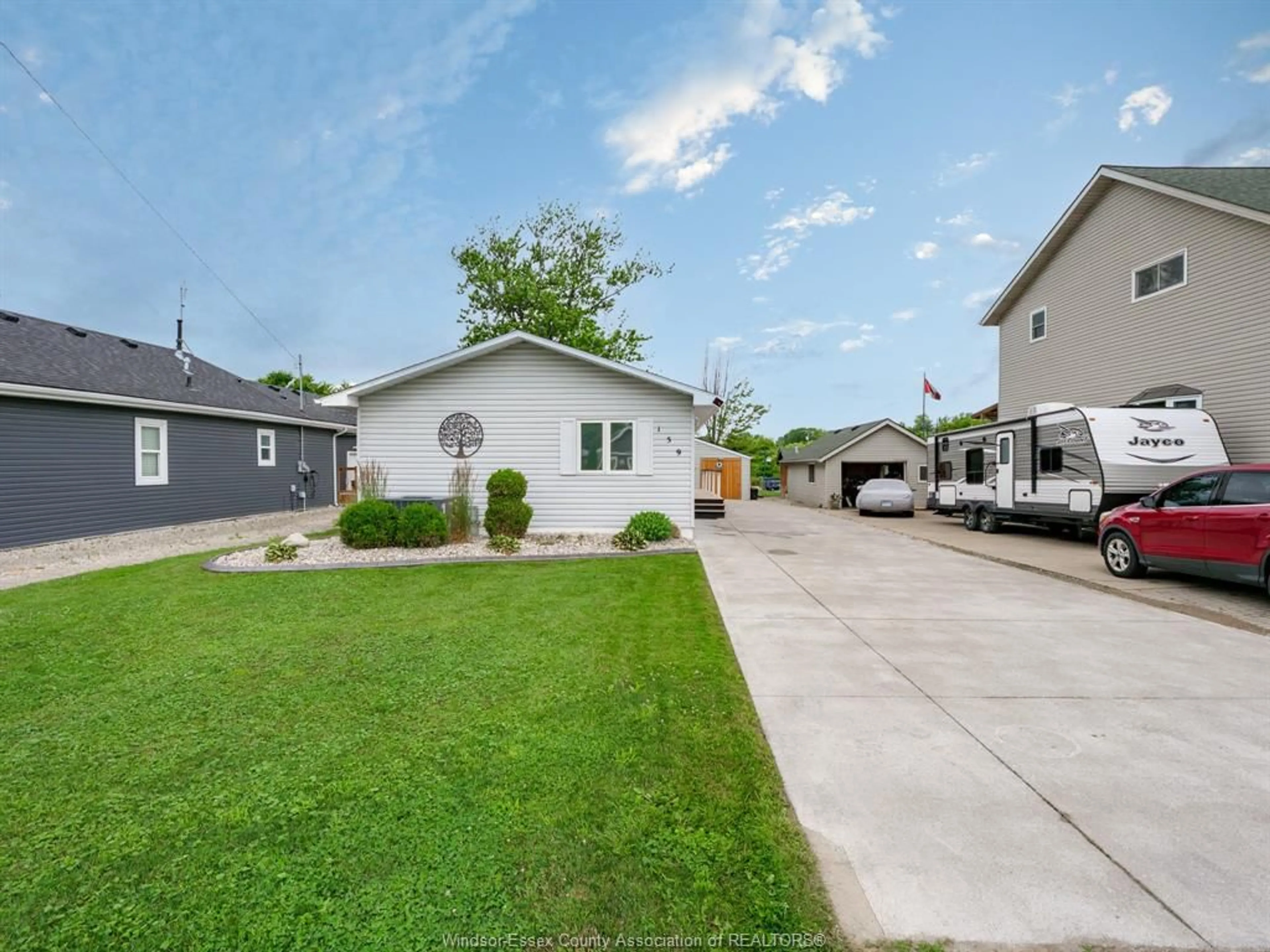 A pic from outside/outdoor area/front of a property/back of a property/a pic from drone, street for 159 EAST PUCE ROAD, Lakeshore Ontario N0R 1A0