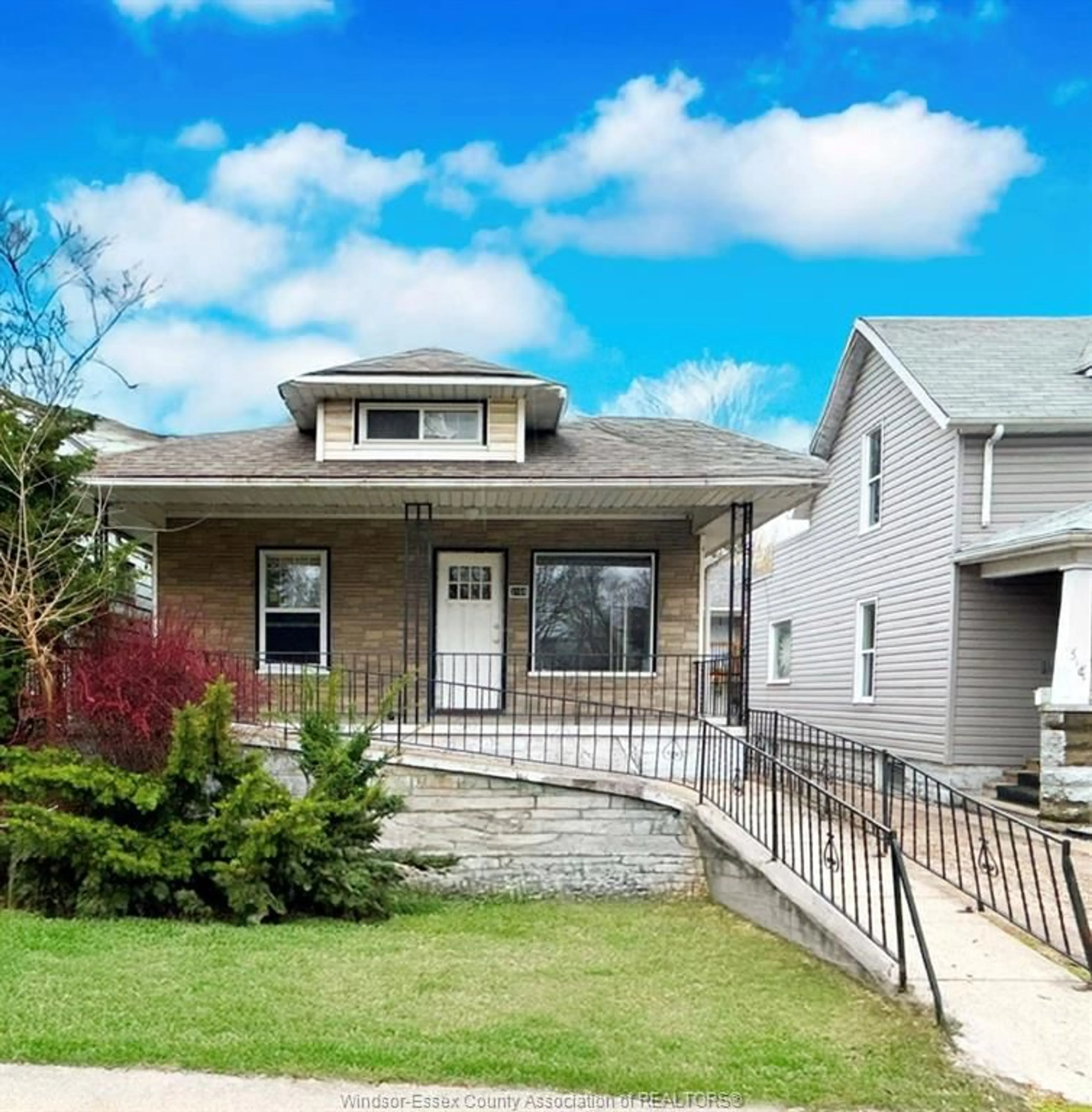 Home with vinyl exterior material, street for 3168 WYANDOTTE St, Windsor Ontario N9C 1M6