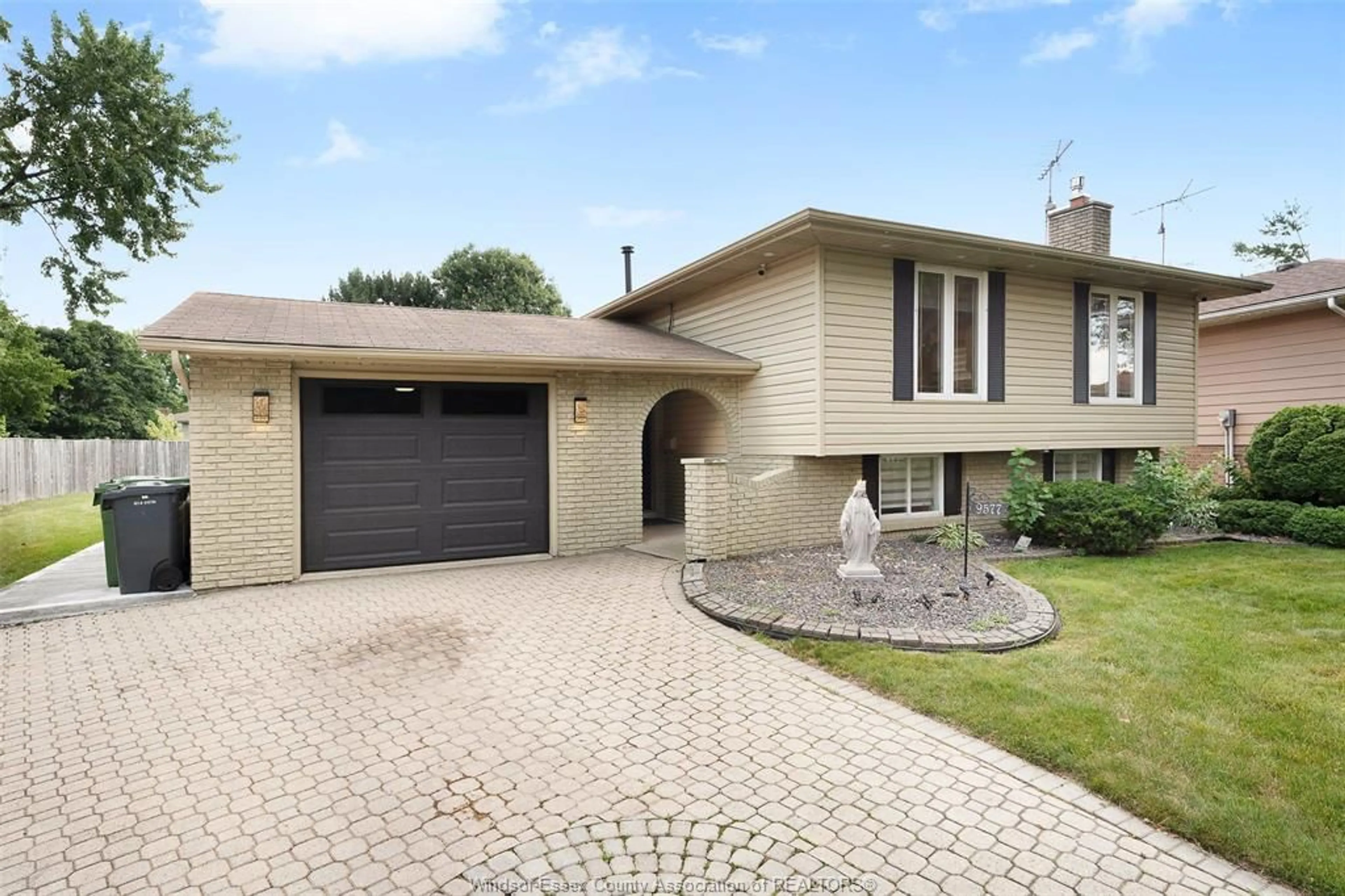Home with brick exterior material, street for 9577 MIDFIELD Cres, Windsor Ontario N8R 1W9