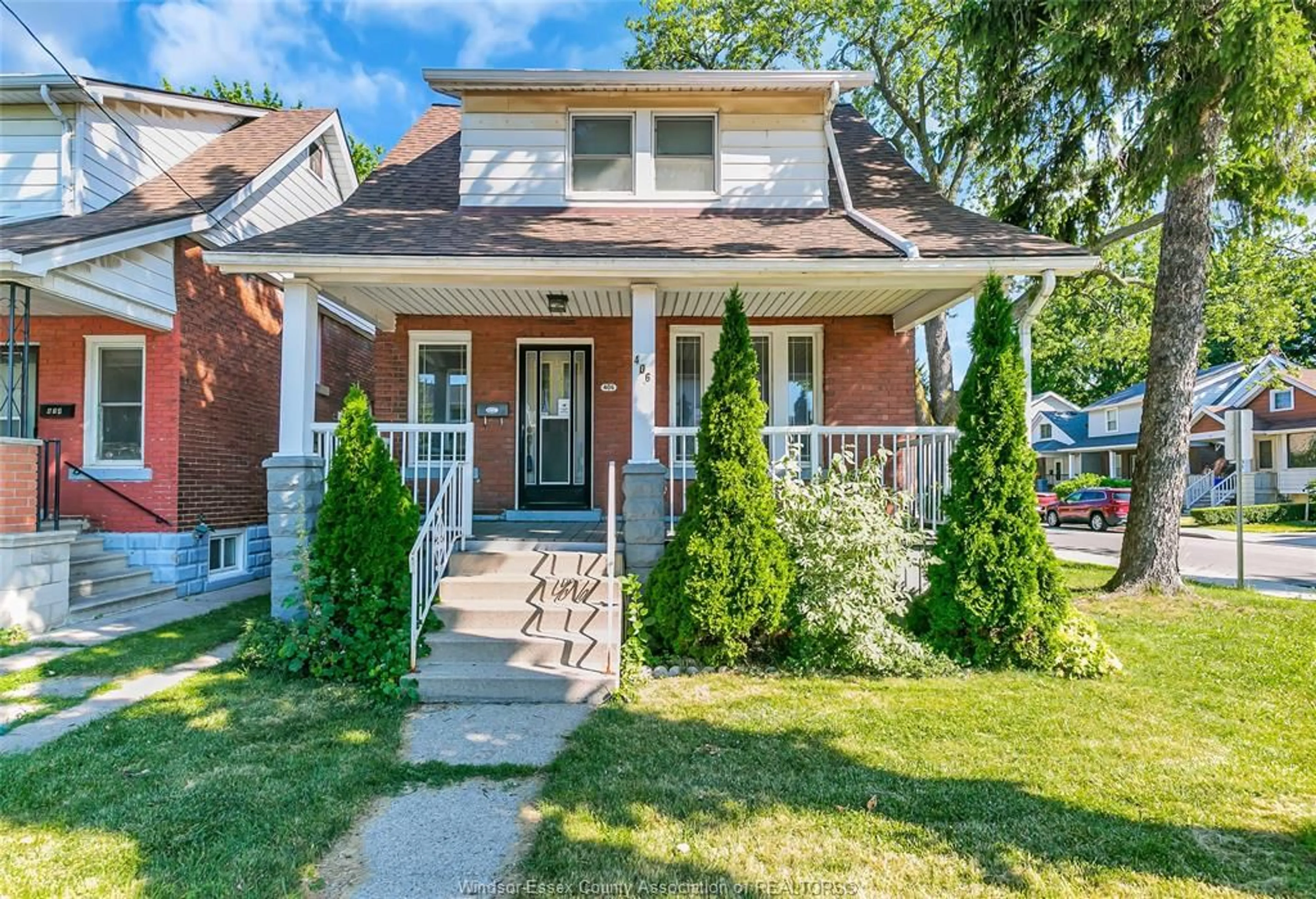 Home with brick exterior material, street for 406 ERIE St, Windsor Ontario N9A 6B9