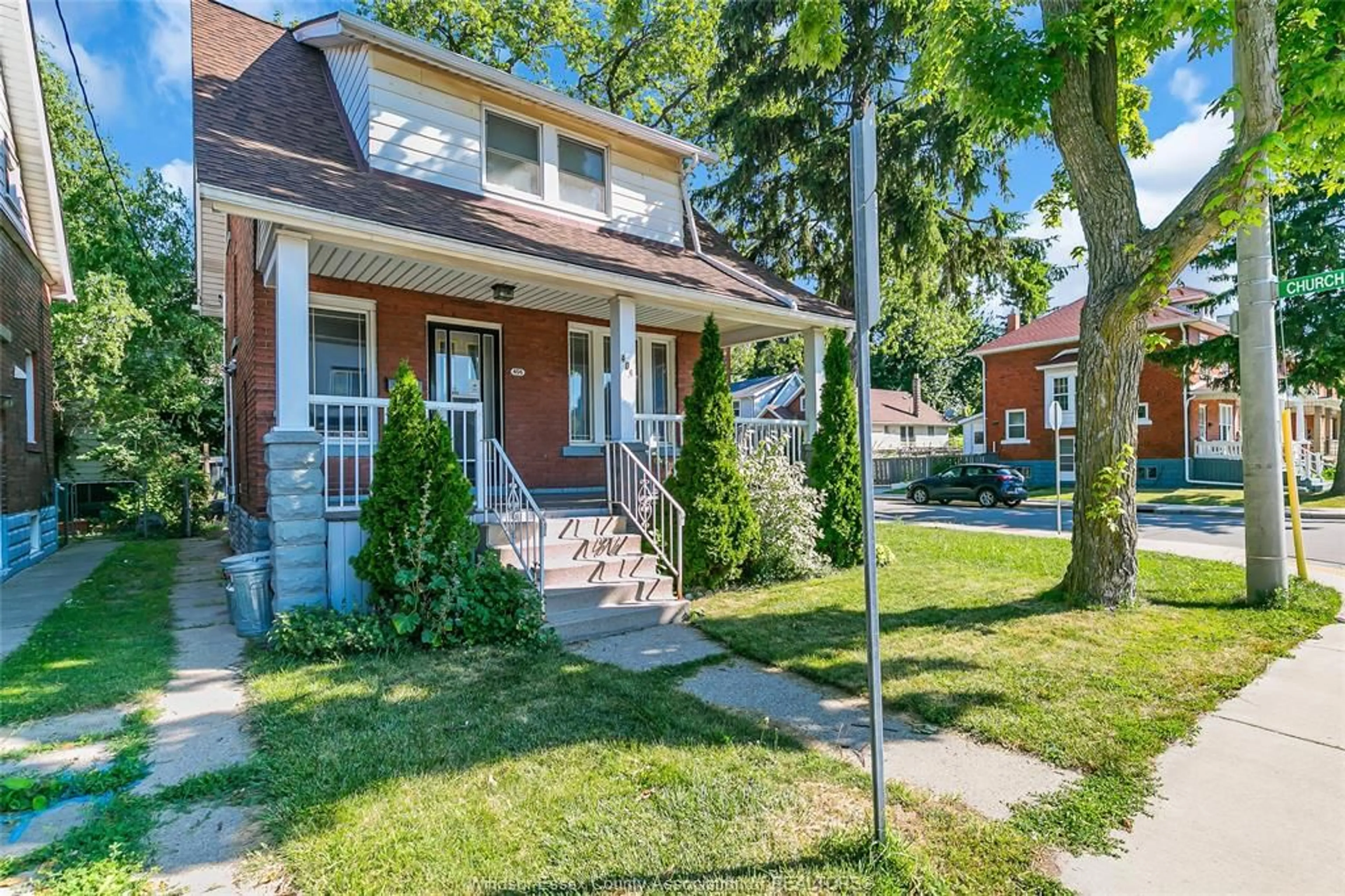 Home with brick exterior material, street for 406 ERIE St, Windsor Ontario N9A 6B9