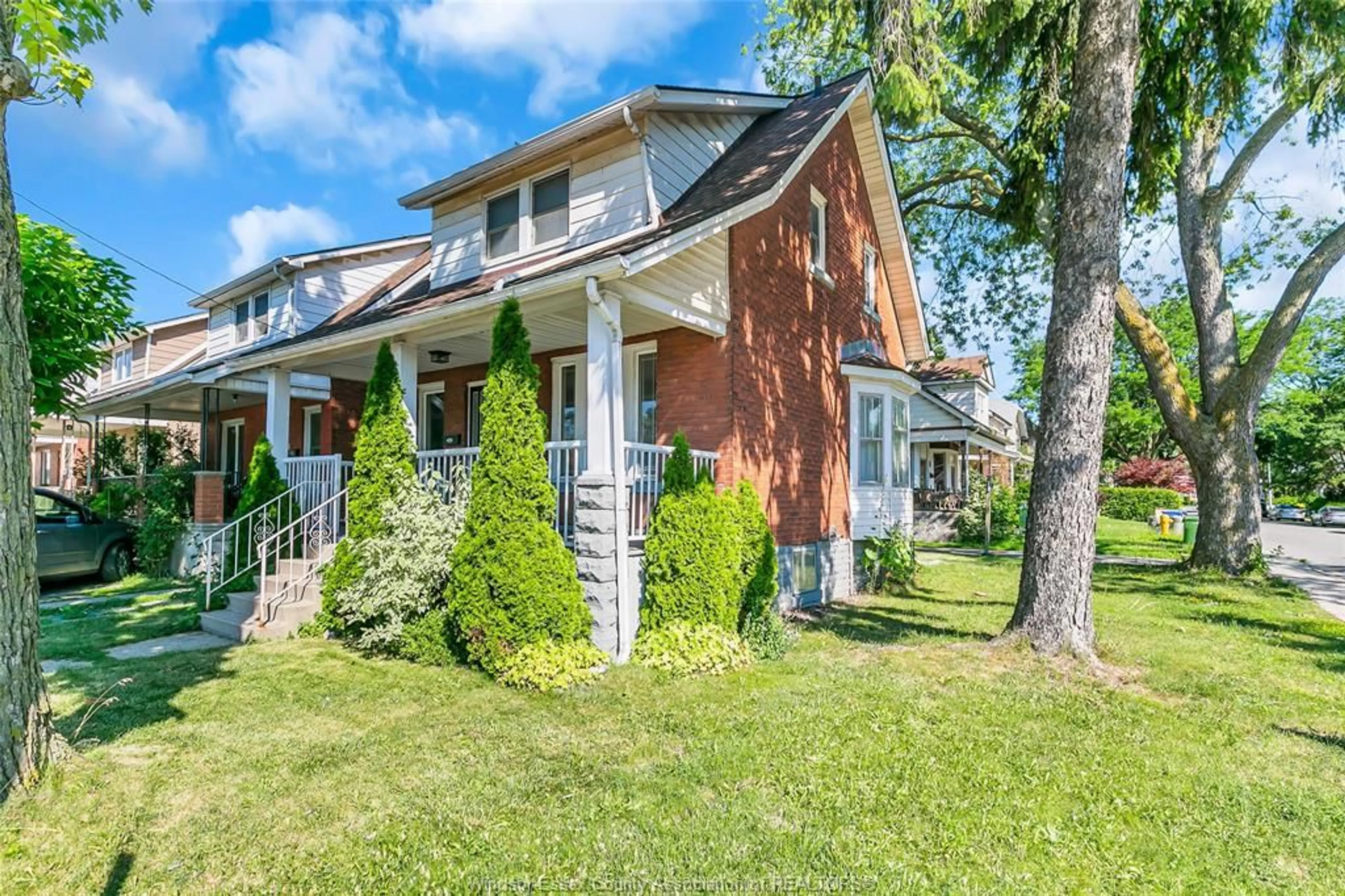 Home with brick exterior material, street for 406 ERIE St, Windsor Ontario N9A 6B9