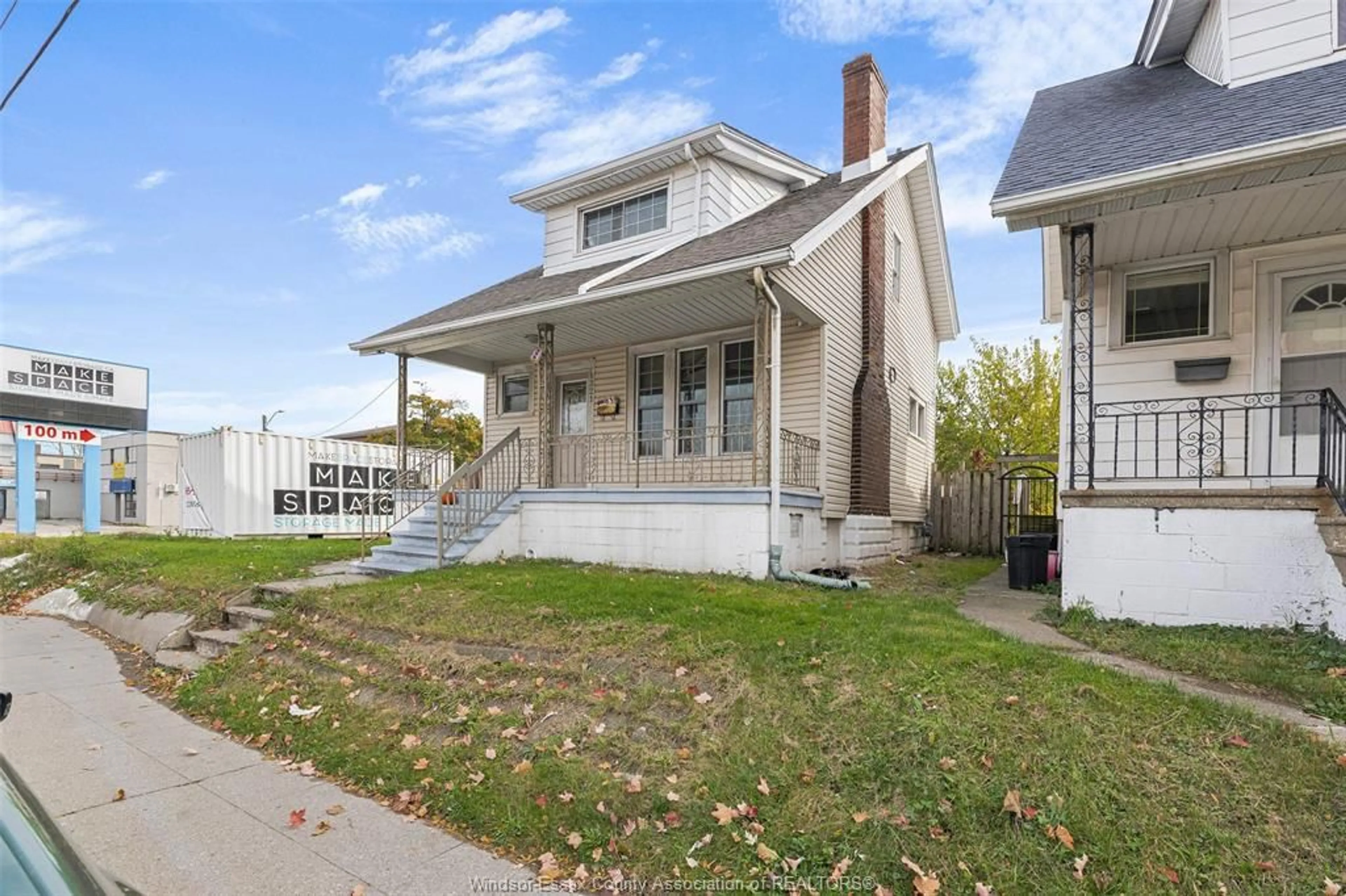 Home with vinyl exterior material, street for 1321 WYANDOTTE St, Windsor Ontario N9B 1H3