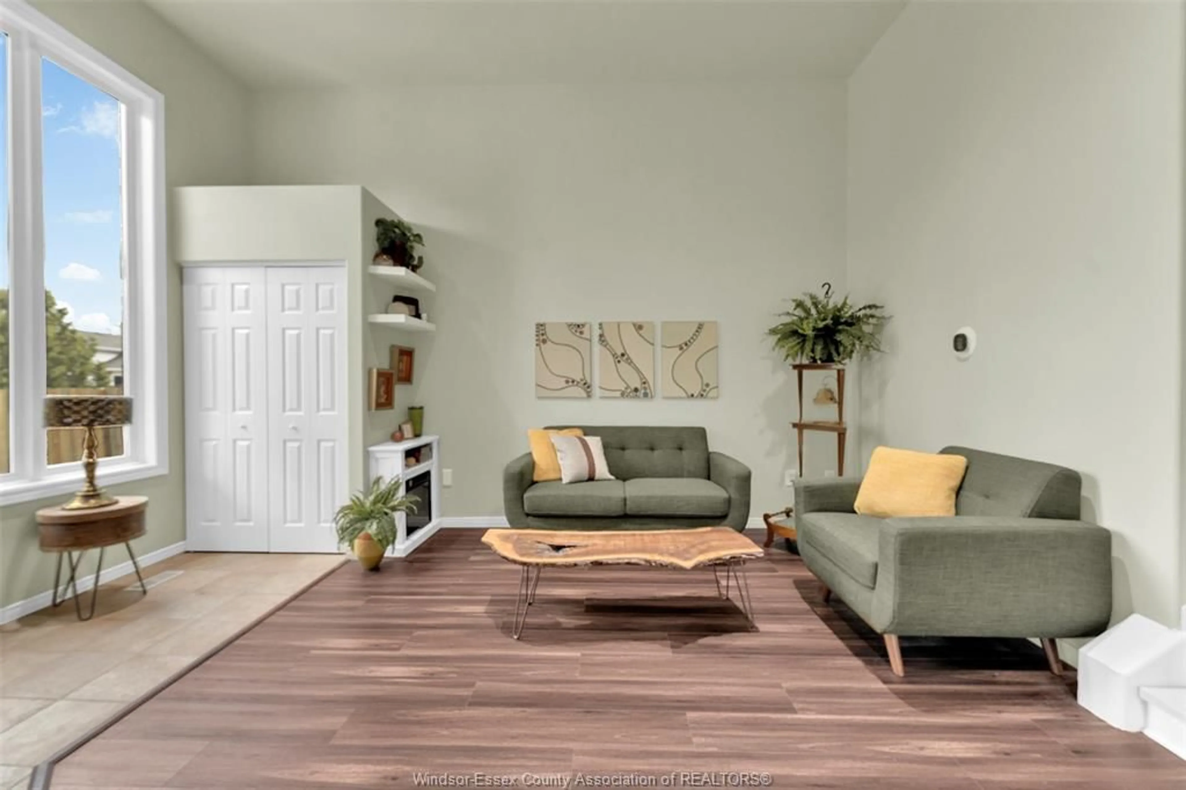 Living room with furniture, wood/laminate floor for 3579 Innerkip Cres, Windsor Ontario N8W 5V1