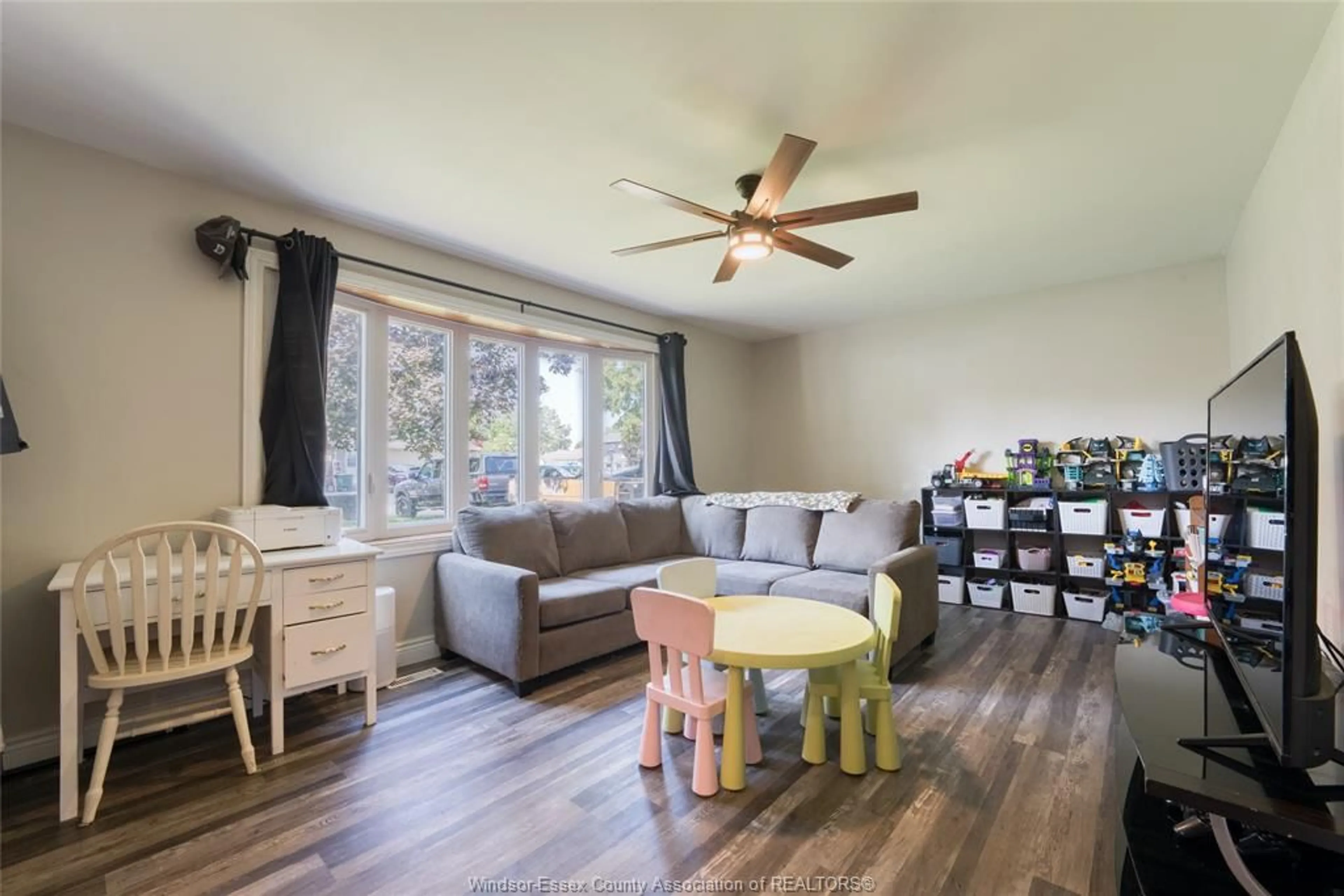 Living room with furniture, wood/laminate floor for 321 MCCURDY, Amherstburg Ontario N9V 3B8