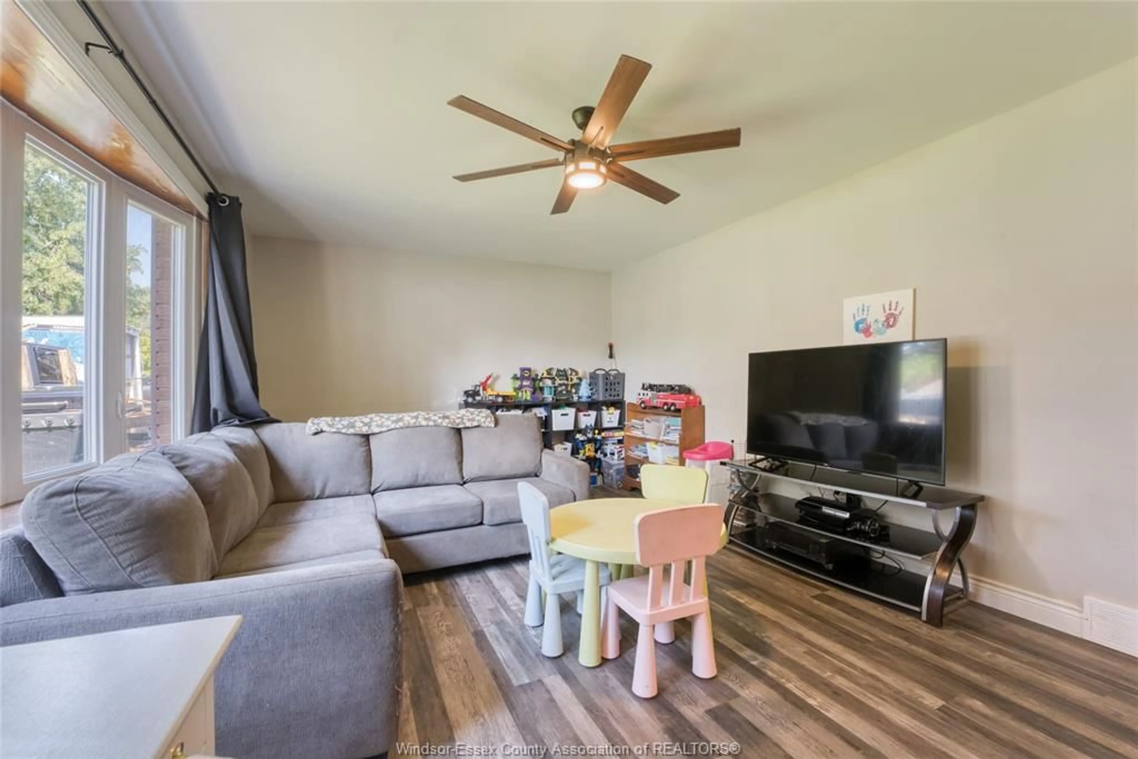 Living room with furniture, wood/laminate floor for 321 MCCURDY, Amherstburg Ontario N9V 3B8