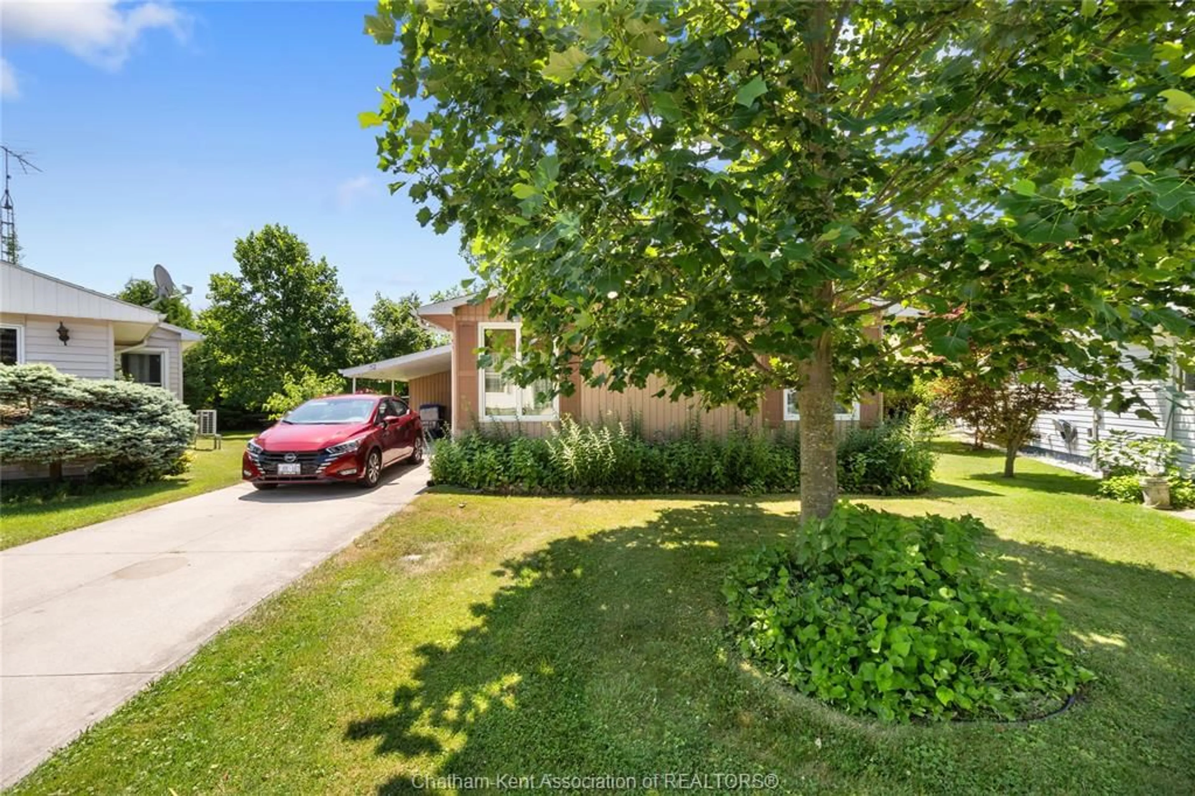 A pic from outside/outdoor area/front of a property/back of a property/a pic from drone, street for 22220 Charing Cross Rd #52, Chatham Ontario N7M 5V8