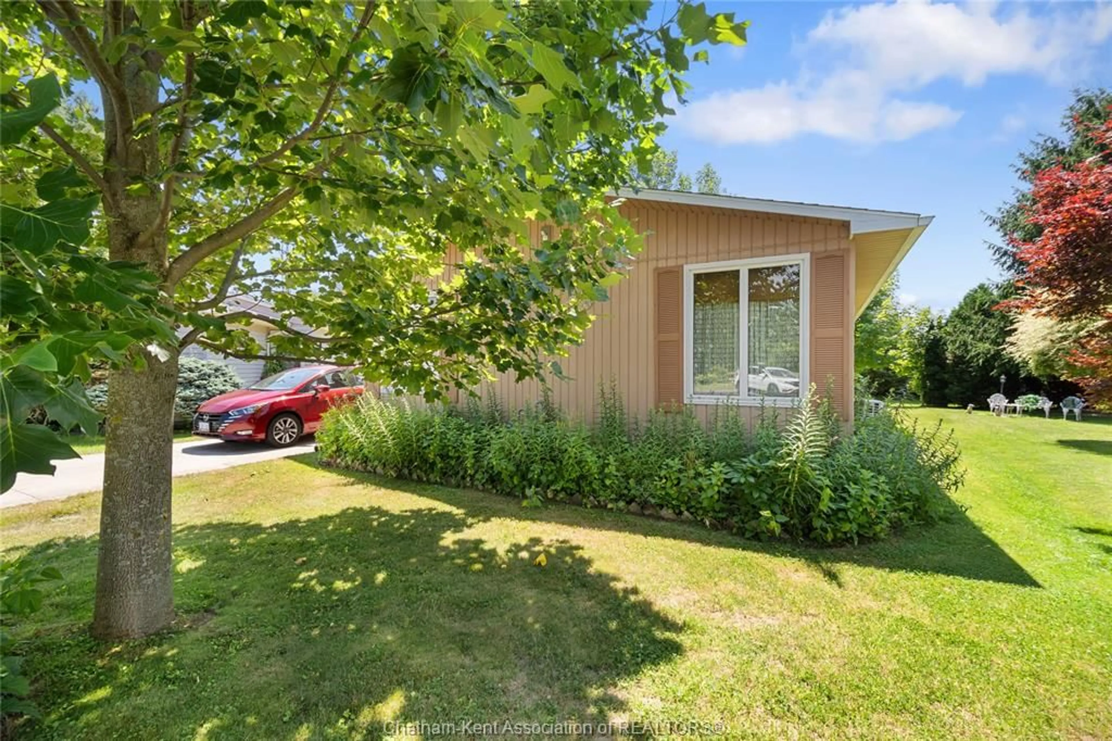 A pic from outside/outdoor area/front of a property/back of a property/a pic from drone, street for 22220 Charing Cross Rd #52, Chatham Ontario N7M 5V8