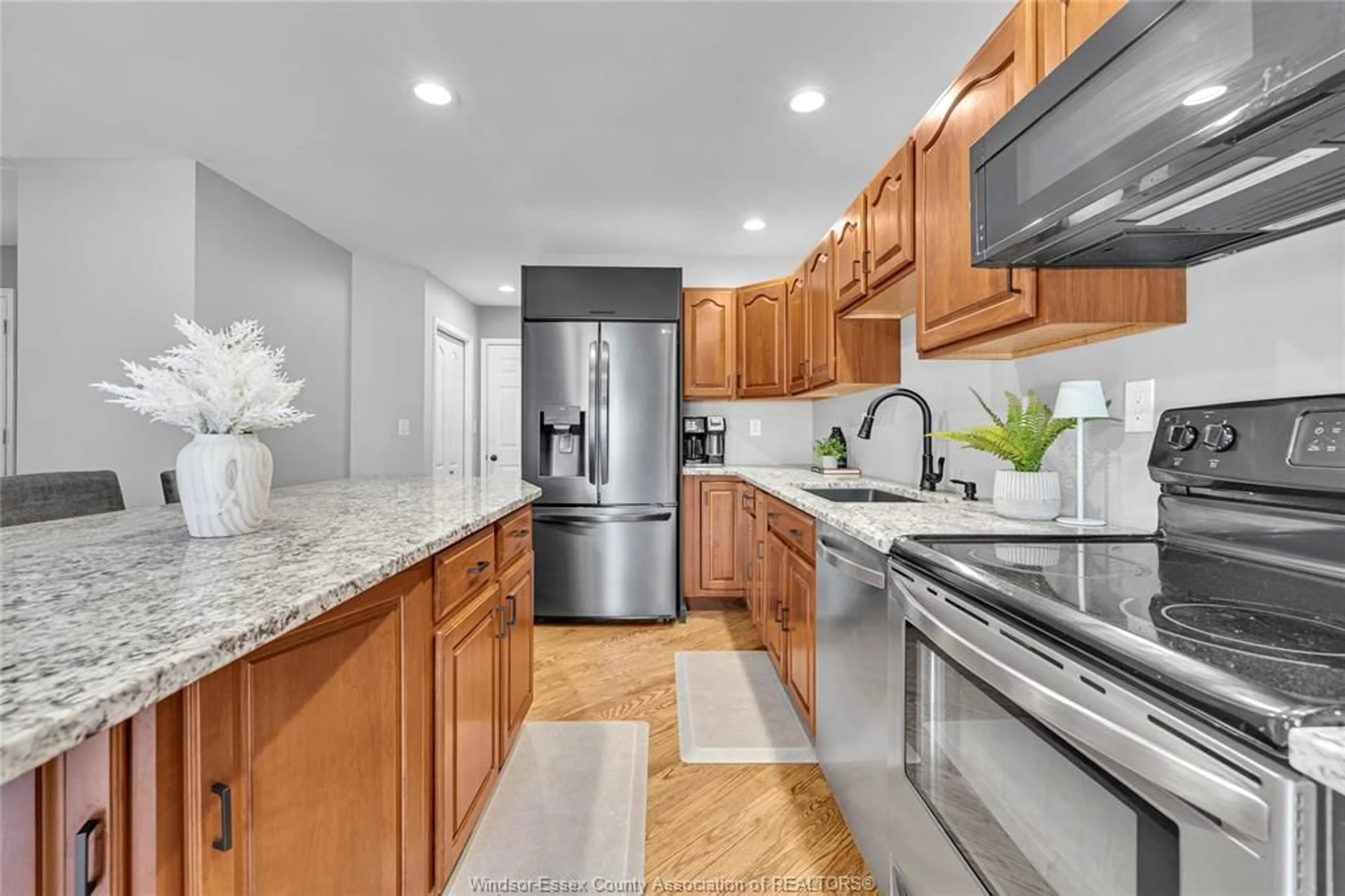 Open concept kitchen, ceramic/tile floor for 211 BAYBERRY, Lakeshore Ontario N0R 1A0
