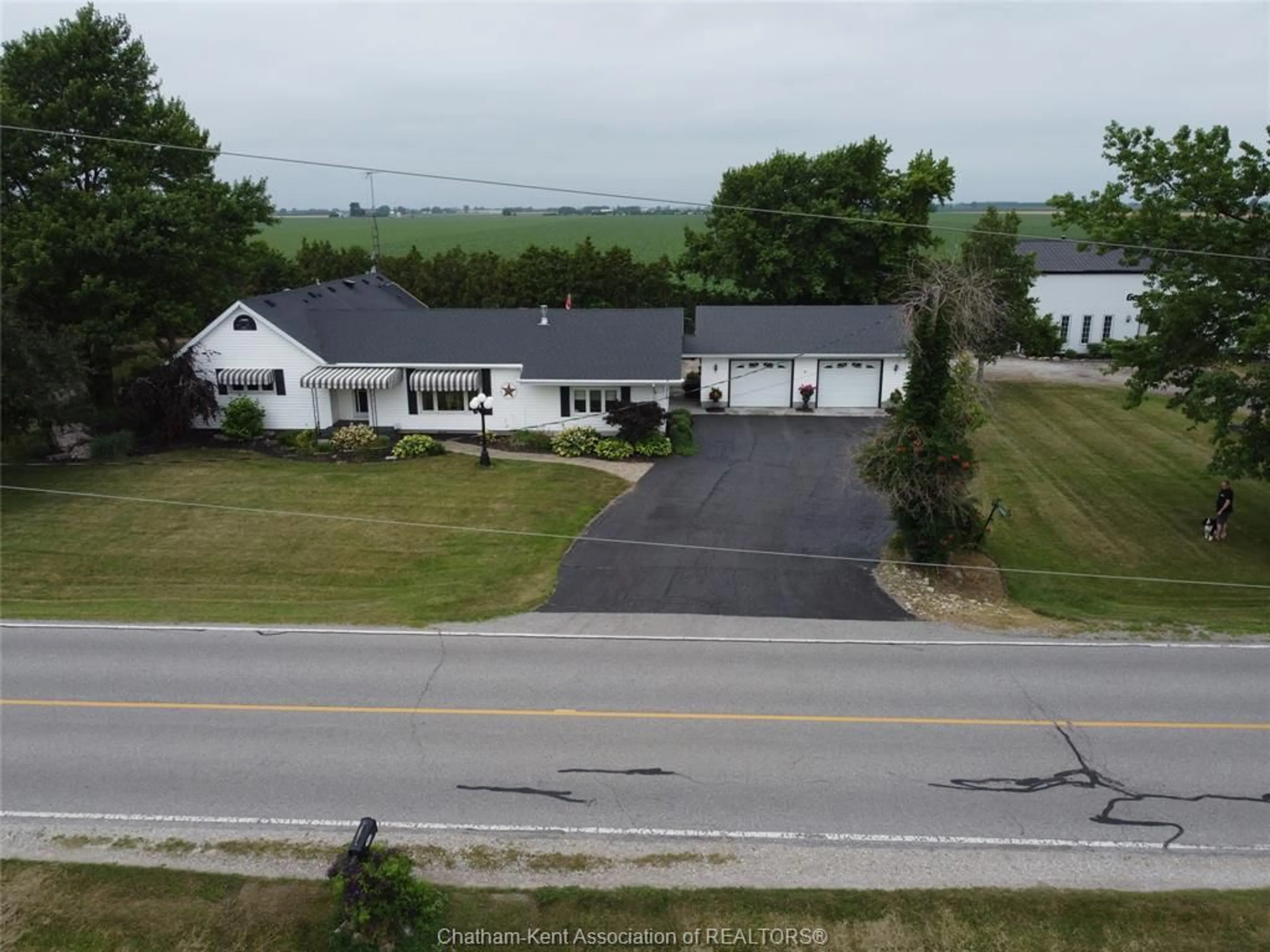 A pic from outside/outdoor area/front of a property/back of a property/a pic from drone, street for 7465 CREEK Line, Chatham Ontario N7M 5J7