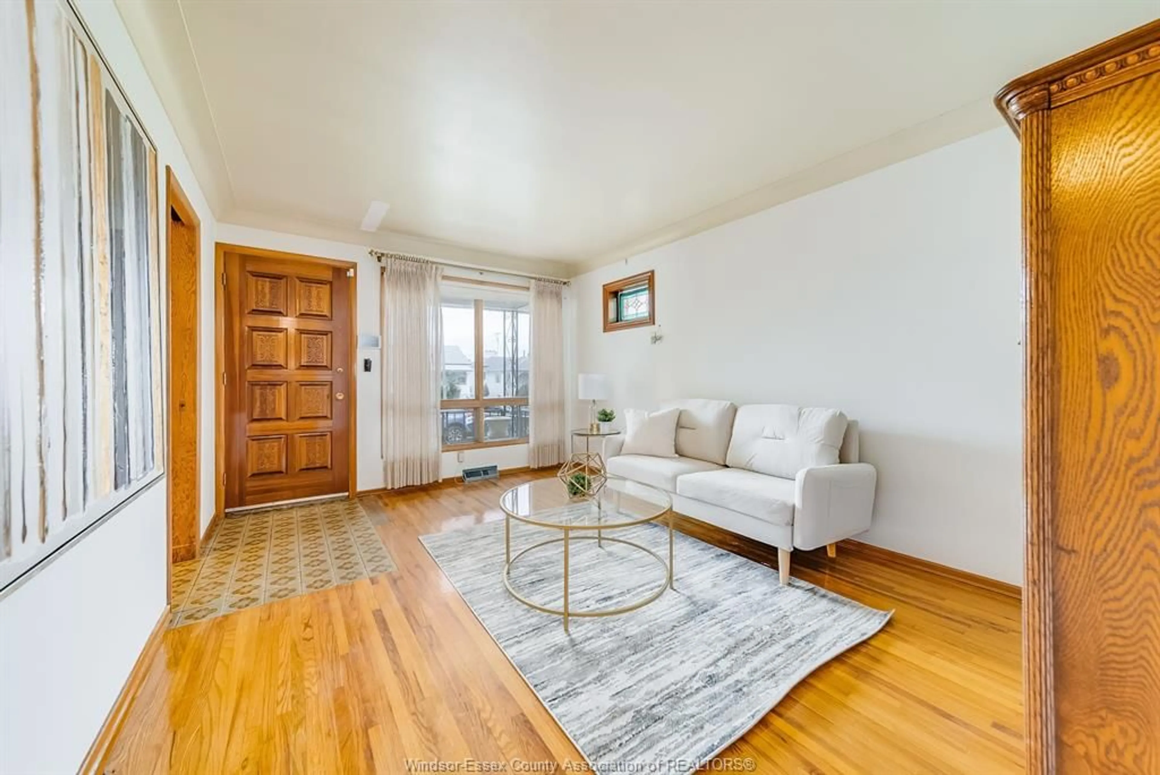 Living room with furniture, wood/laminate floor for 1669 PARENT, Windsor Ontario N8X 4J9