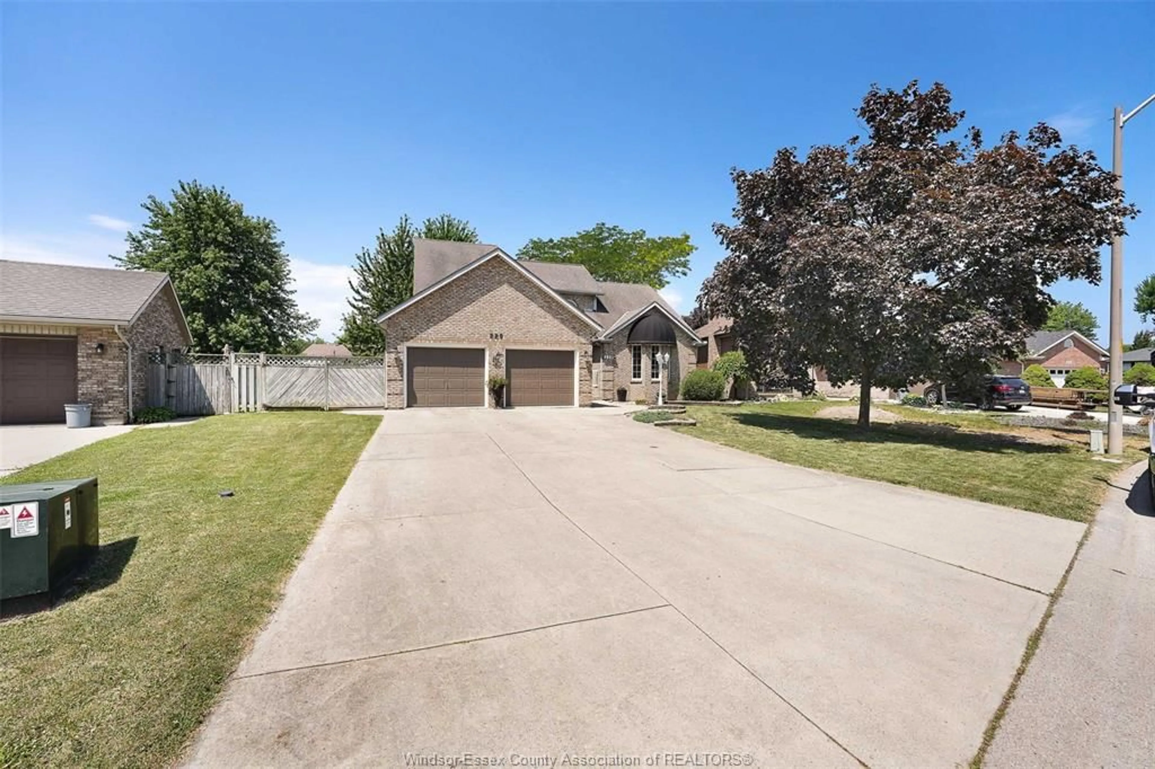 A pic from outside/outdoor area/front of a property/back of a property/a pic from drone, street for 229 GREENWOOD Cres, Lakeshore Ontario N0R 1A0
