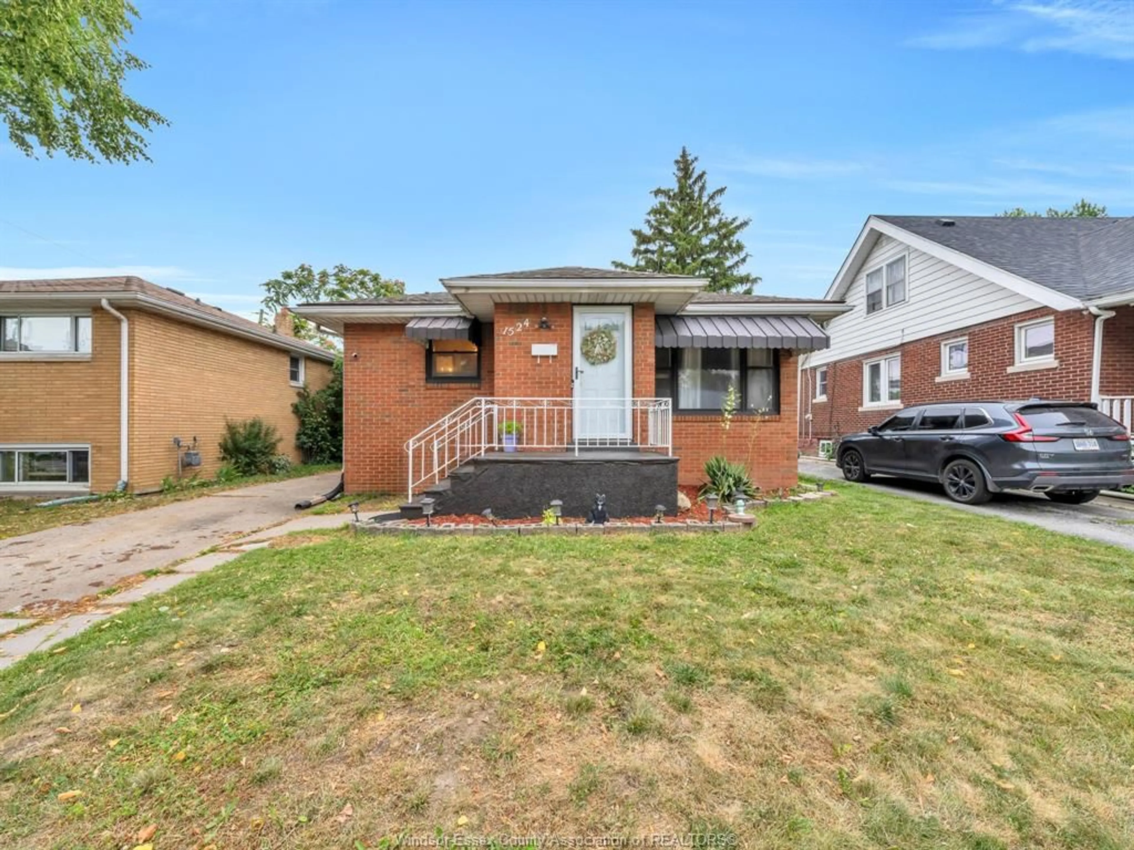 Home with brick exterior material, street for 1524 PILLETTE Rd, Windsor Ontario N8Y 3C2