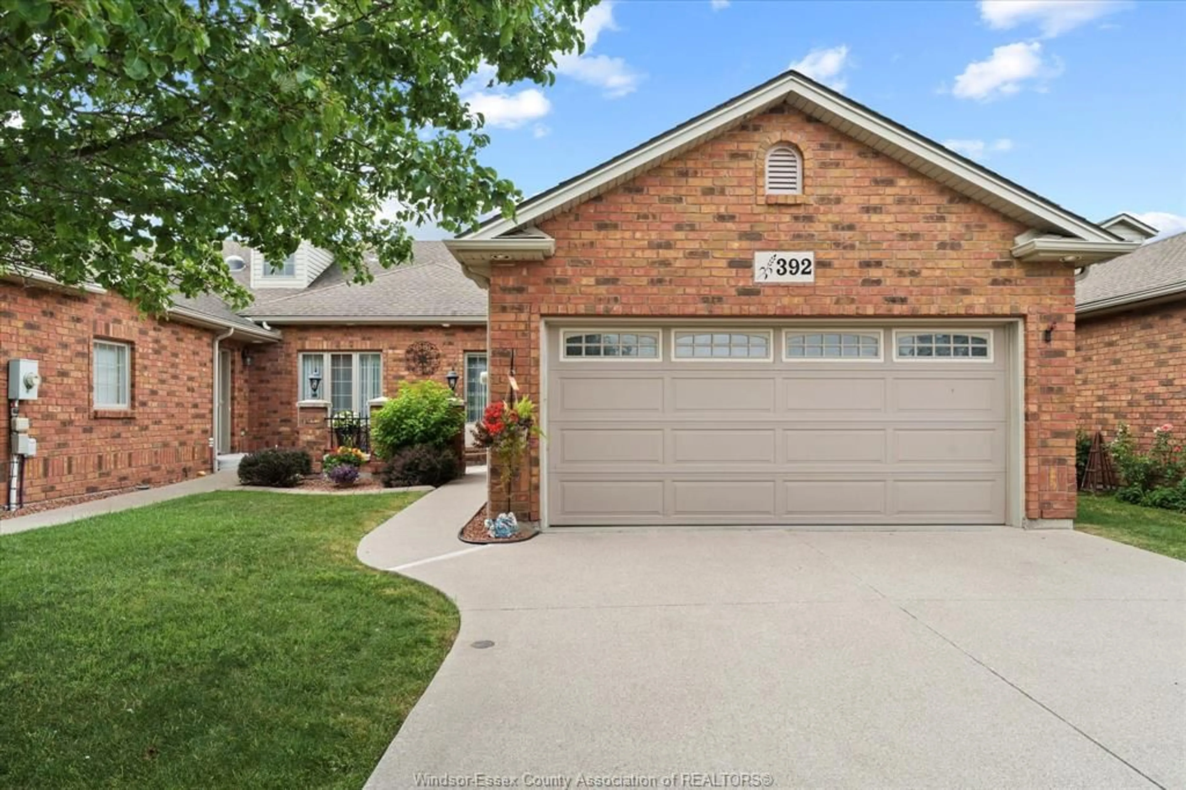 Home with brick exterior material, street for 392 Lenore Street, Belle River Ontario N8L 0P3