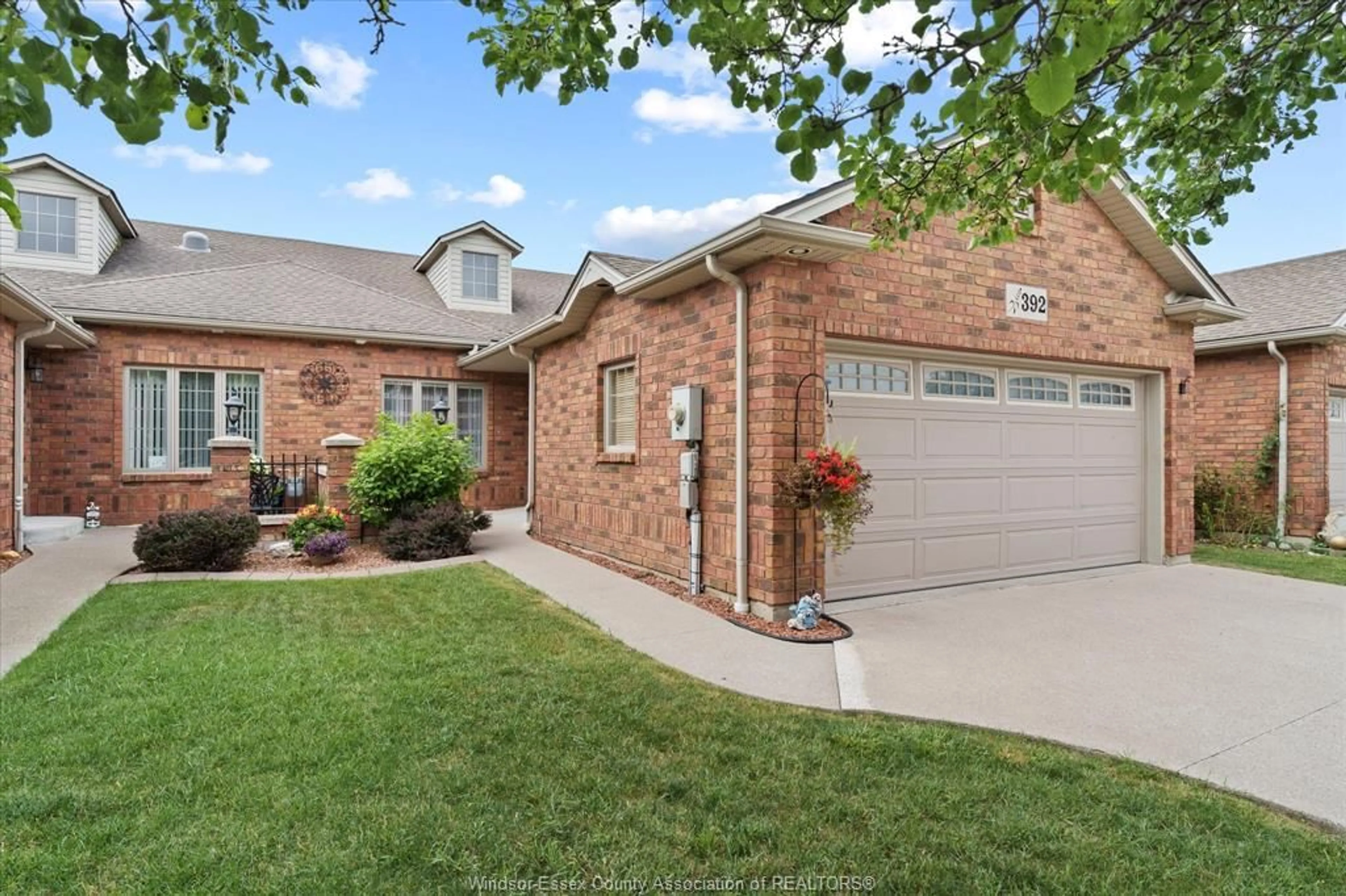 Home with brick exterior material, street for 392 Lenore Street, Belle River Ontario N8L 0P3