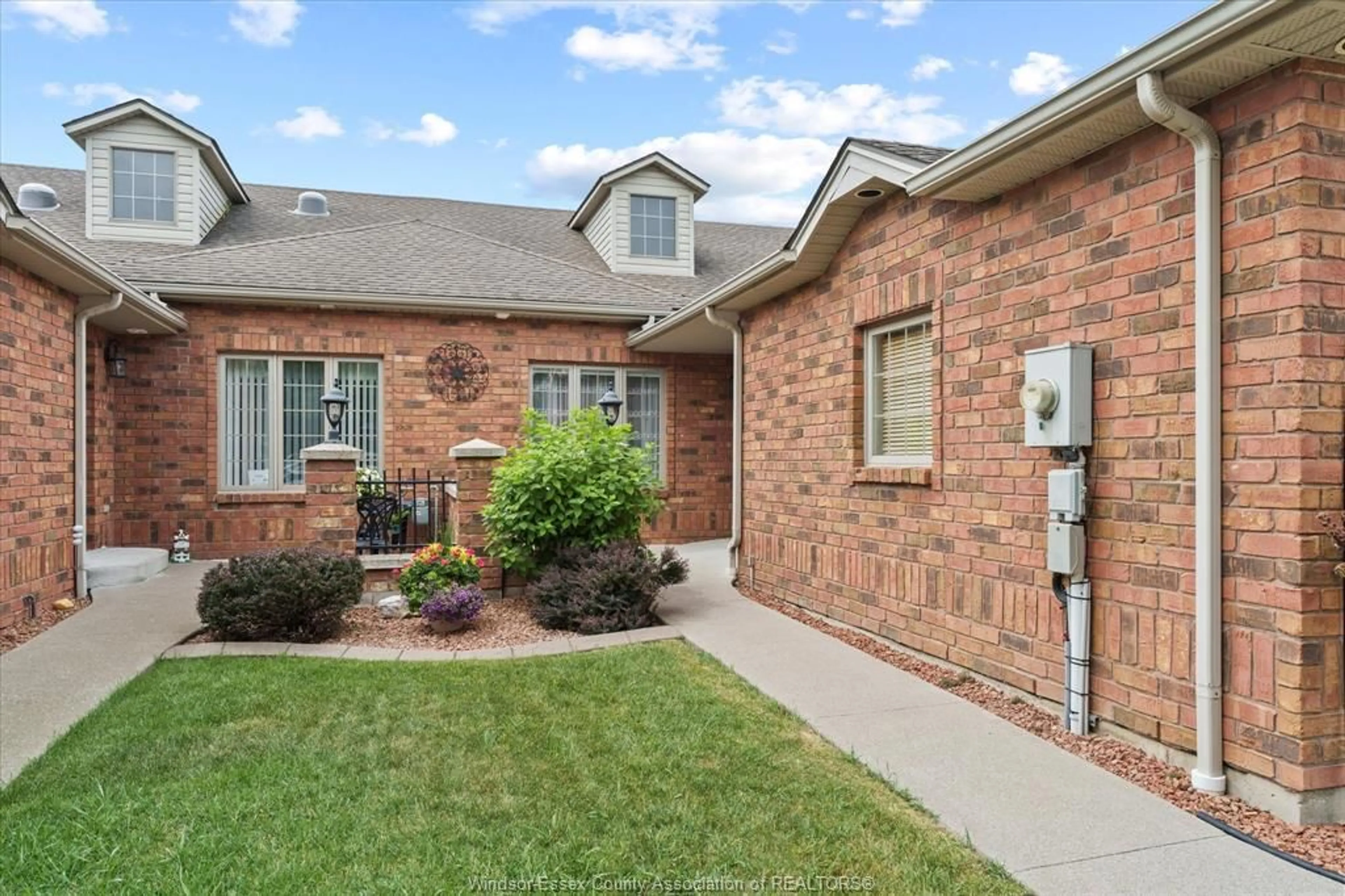 Home with brick exterior material, street for 392 Lenore Street, Belle River Ontario N8L 0P3