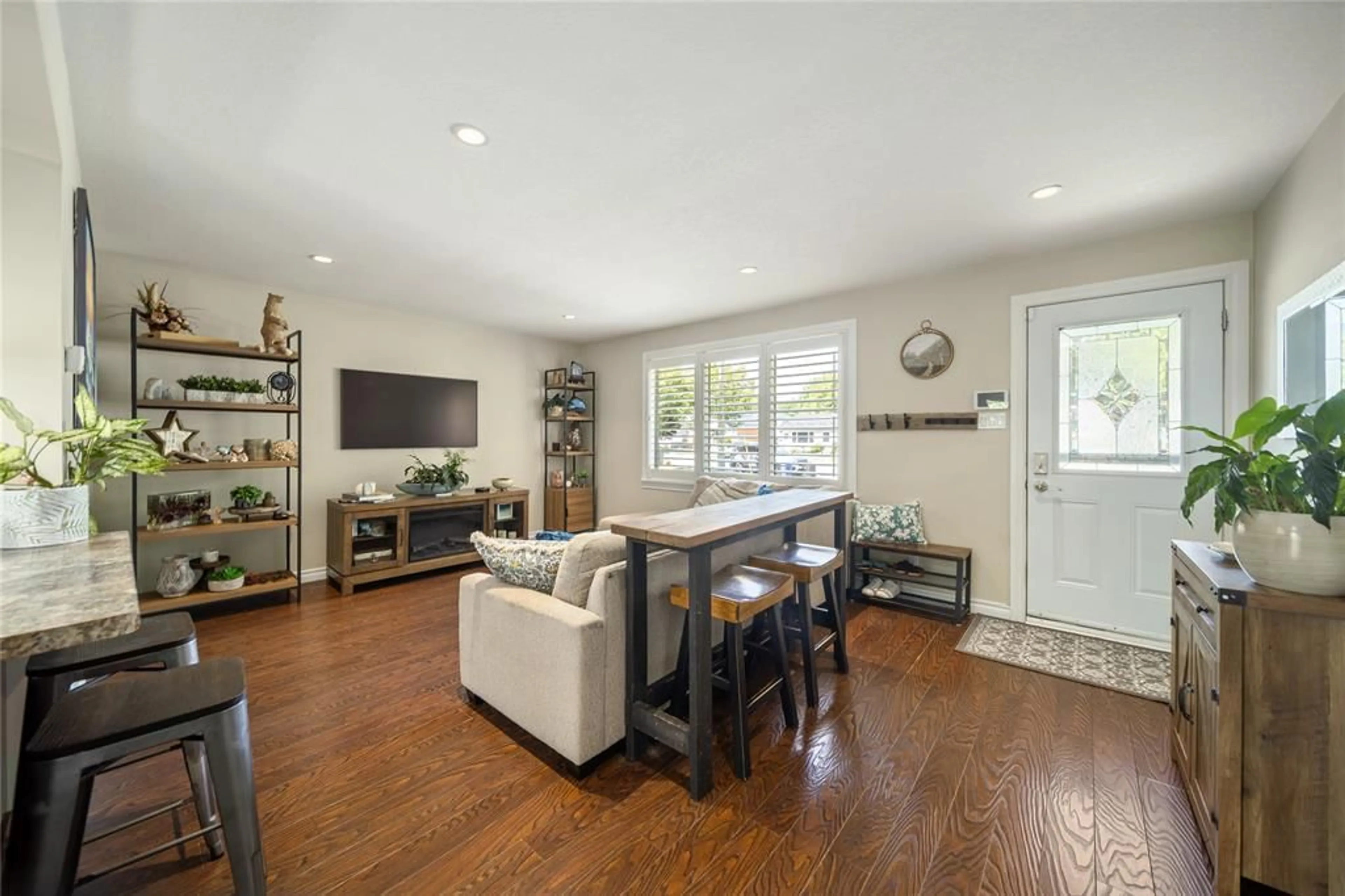 Living room with furniture, wood/laminate floor for 1544 Colborne Rd, Sarnia Ontario N7V 3M4