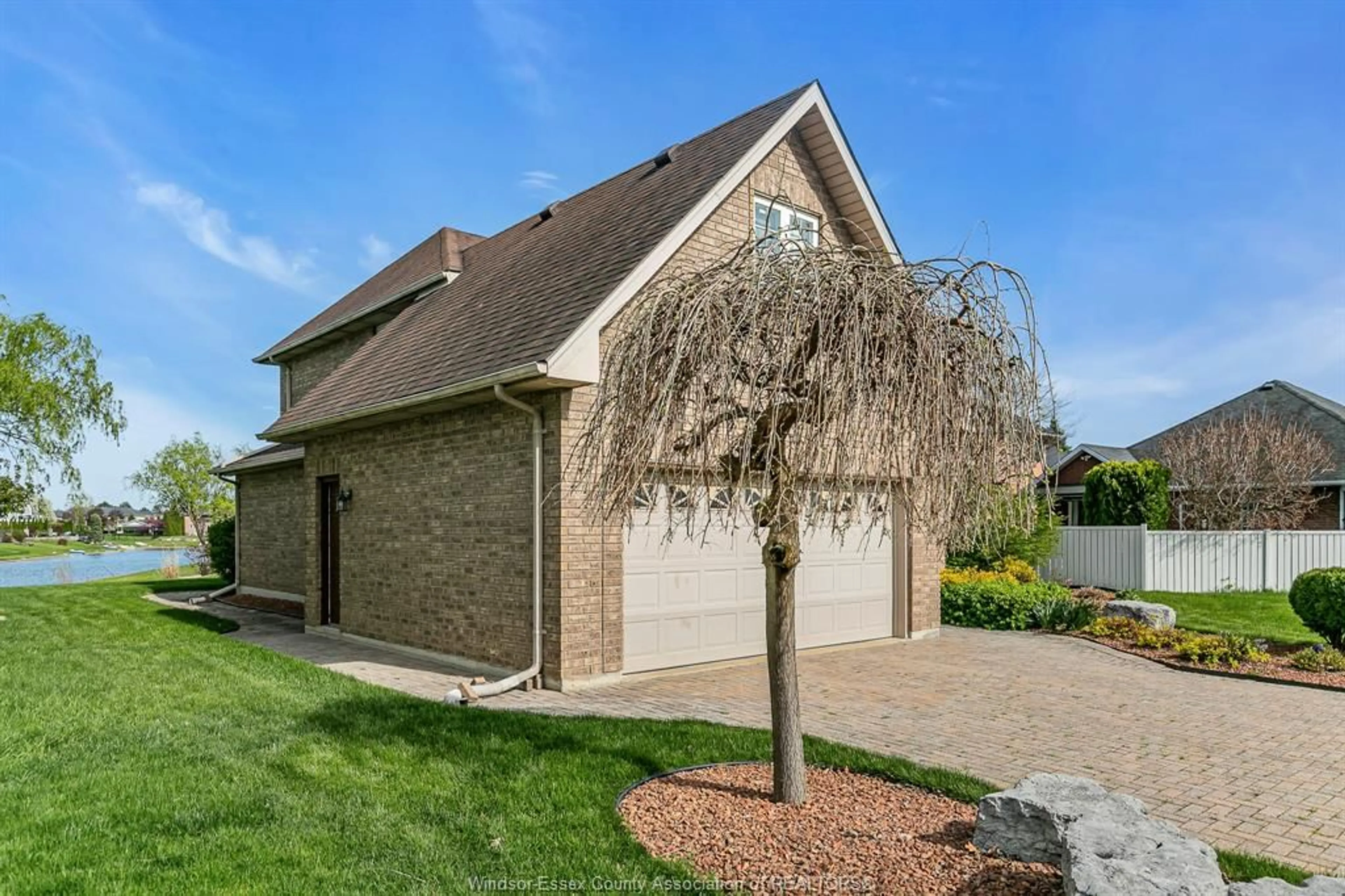 Home with brick exterior material, street for 5023 SOUTHWOOD LAKES, Windsor Ontario N9G 2Y1