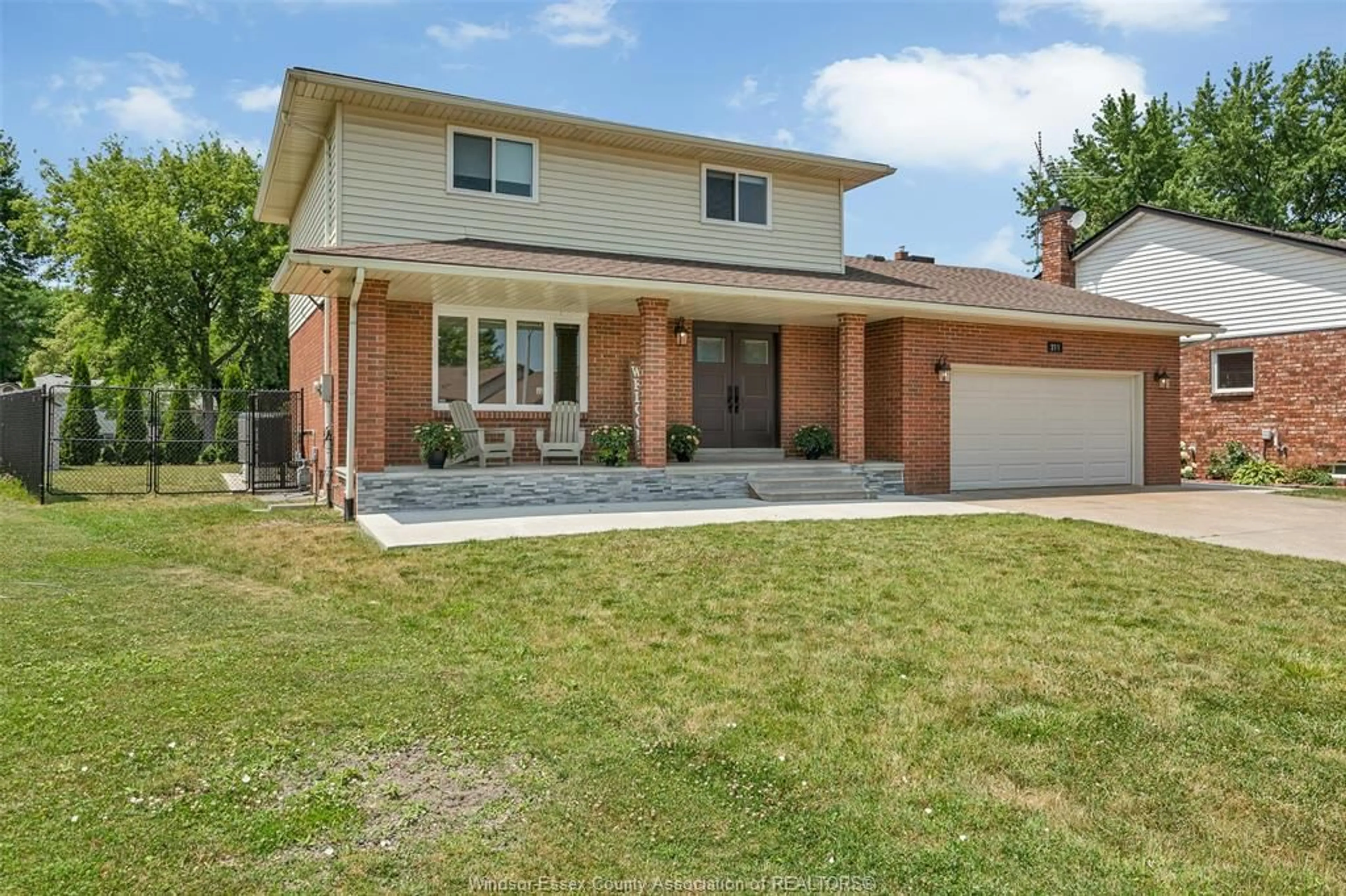 Home with brick exterior material, street for 211 WEDGEWOOD Lane, Tecumseh Ontario N8N 4J4