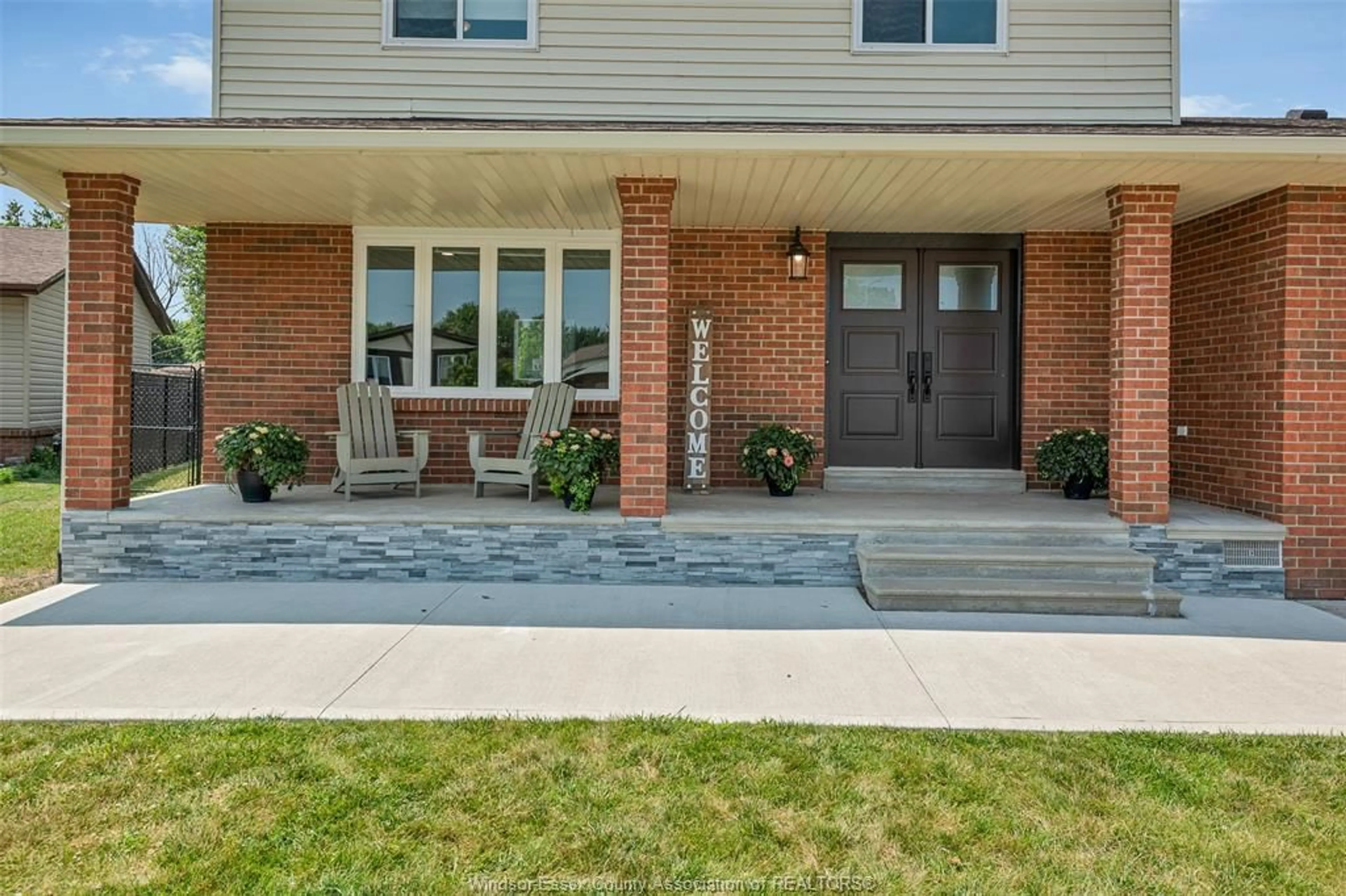 Home with brick exterior material, street for 211 WEDGEWOOD Lane, Tecumseh Ontario N8N 4J4