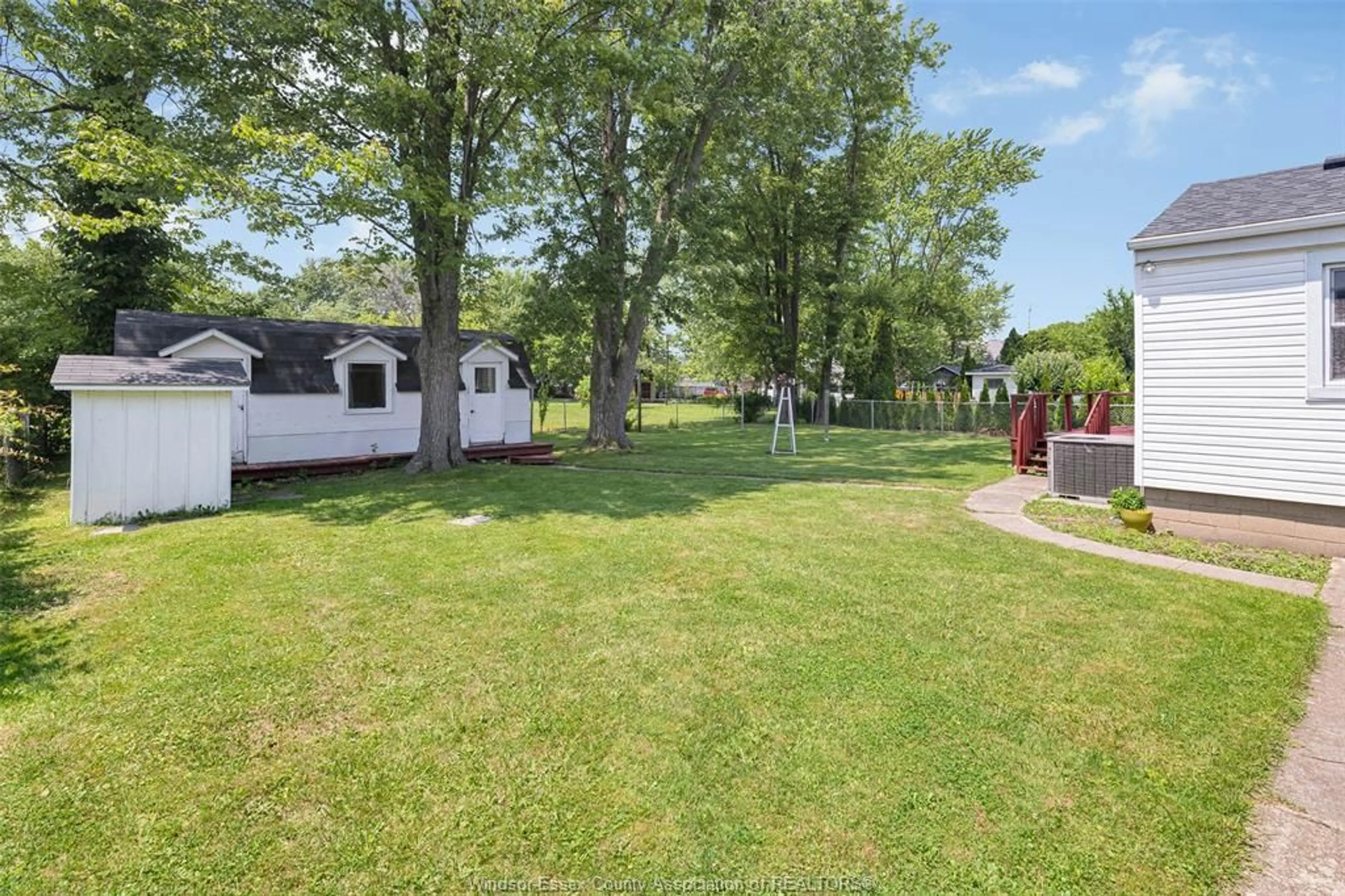A pic from outside/outdoor area/front of a property/back of a property/a pic from drone, street for 211 DUBOIS Ave, Lakeshore Ontario N0R 1C0