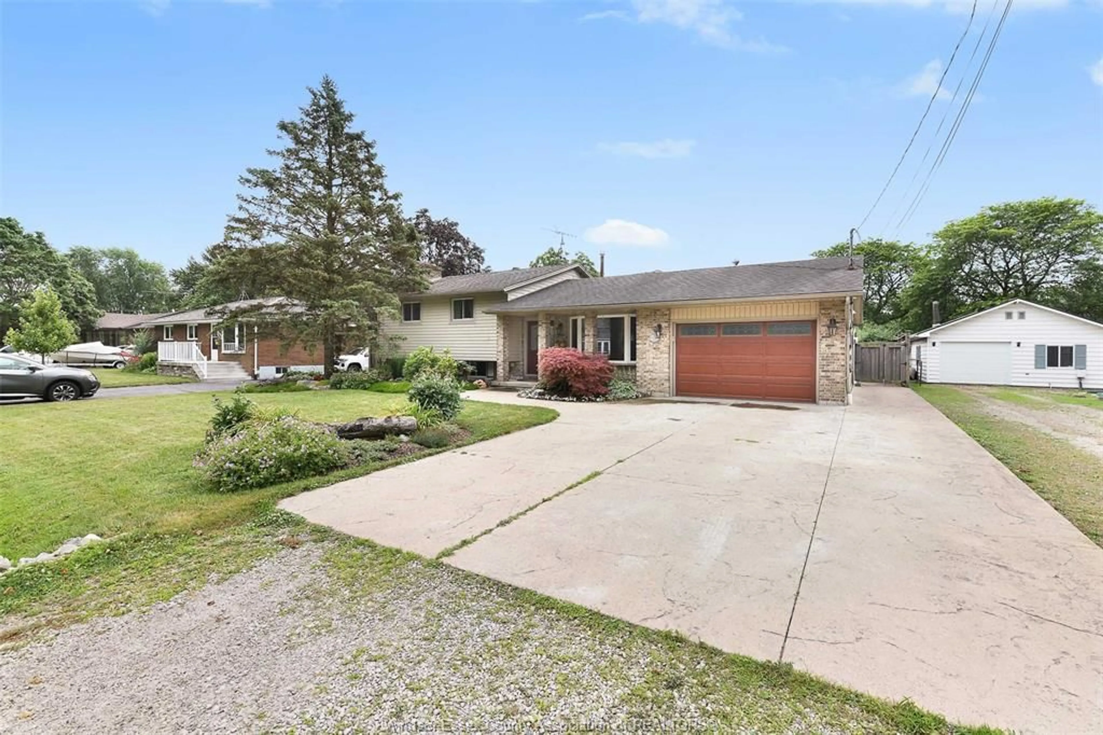A pic from outside/outdoor area/front of a property/back of a property/a pic from drone, street for 1935 CANARD Dr, LaSalle Ontario N9J 2S7