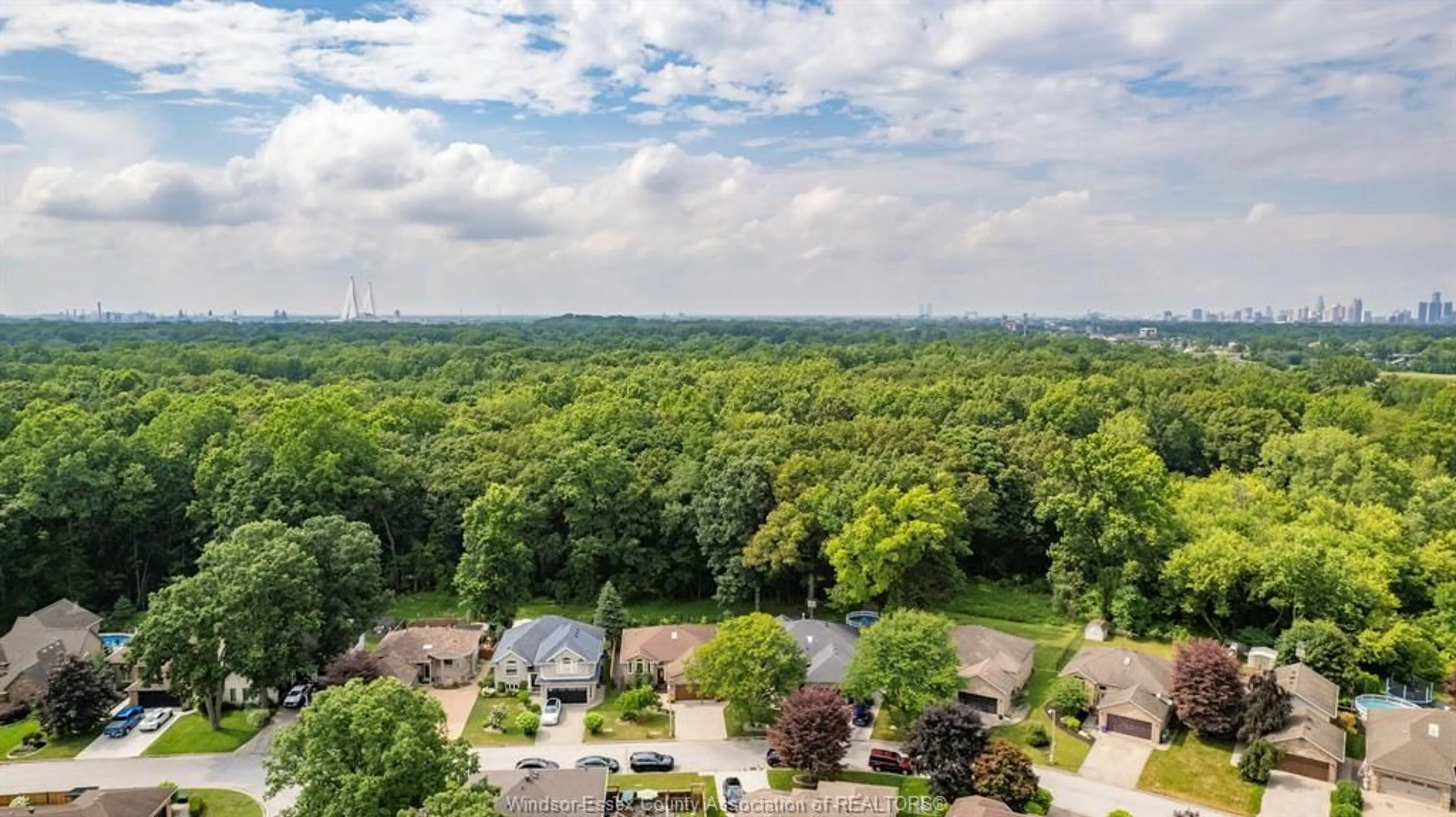 A pic from outside/outdoor area/front of a property/back of a property/a pic from drone, forest/trees view for 2188 AMY LYNN Pk, Windsor Ontario N9E 4N2