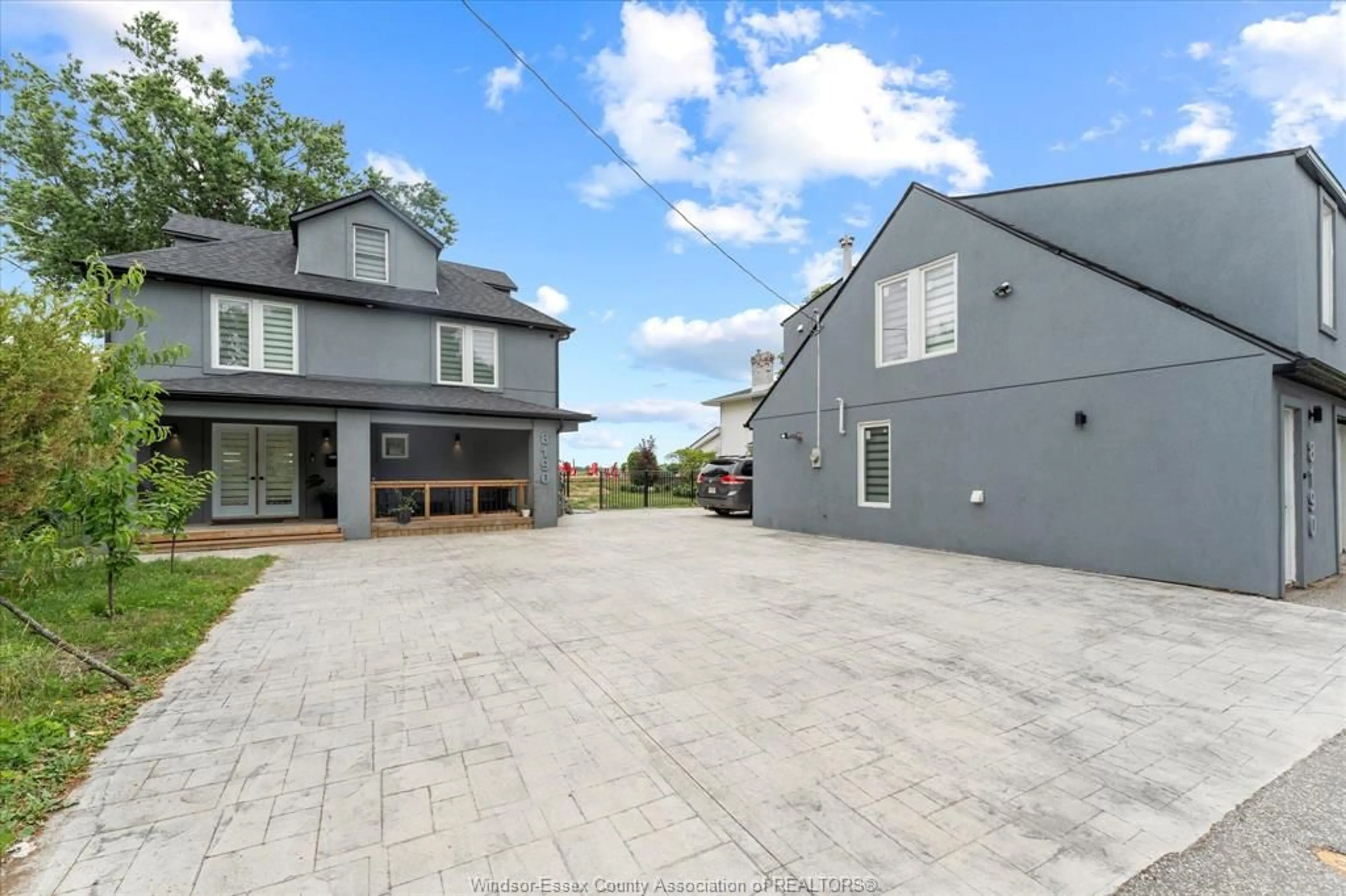 A pic from outside/outdoor area/front of a property/back of a property/a pic from drone, street for 8190 RIVERSIDE Dr, Windsor Ontario N8S 1E4