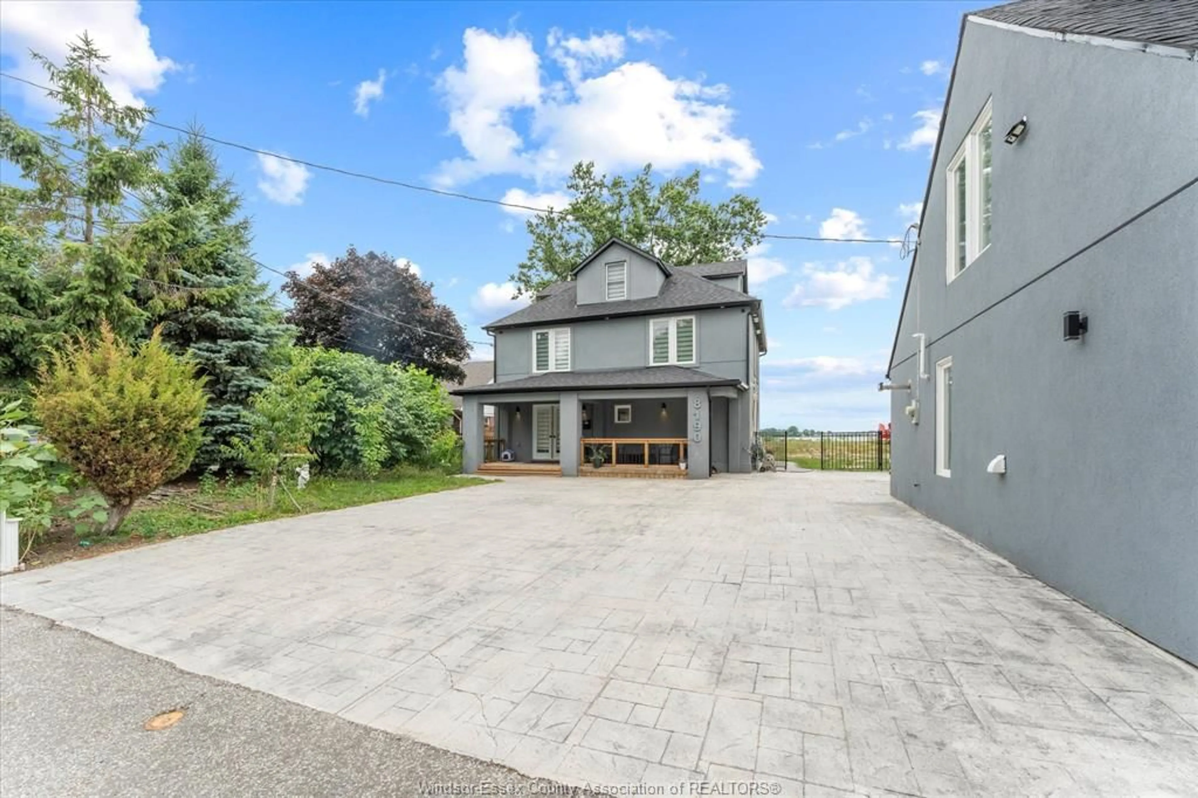 A pic from outside/outdoor area/front of a property/back of a property/a pic from drone, unknown for 8190 RIVERSIDE Dr, Windsor Ontario N8S 1E4