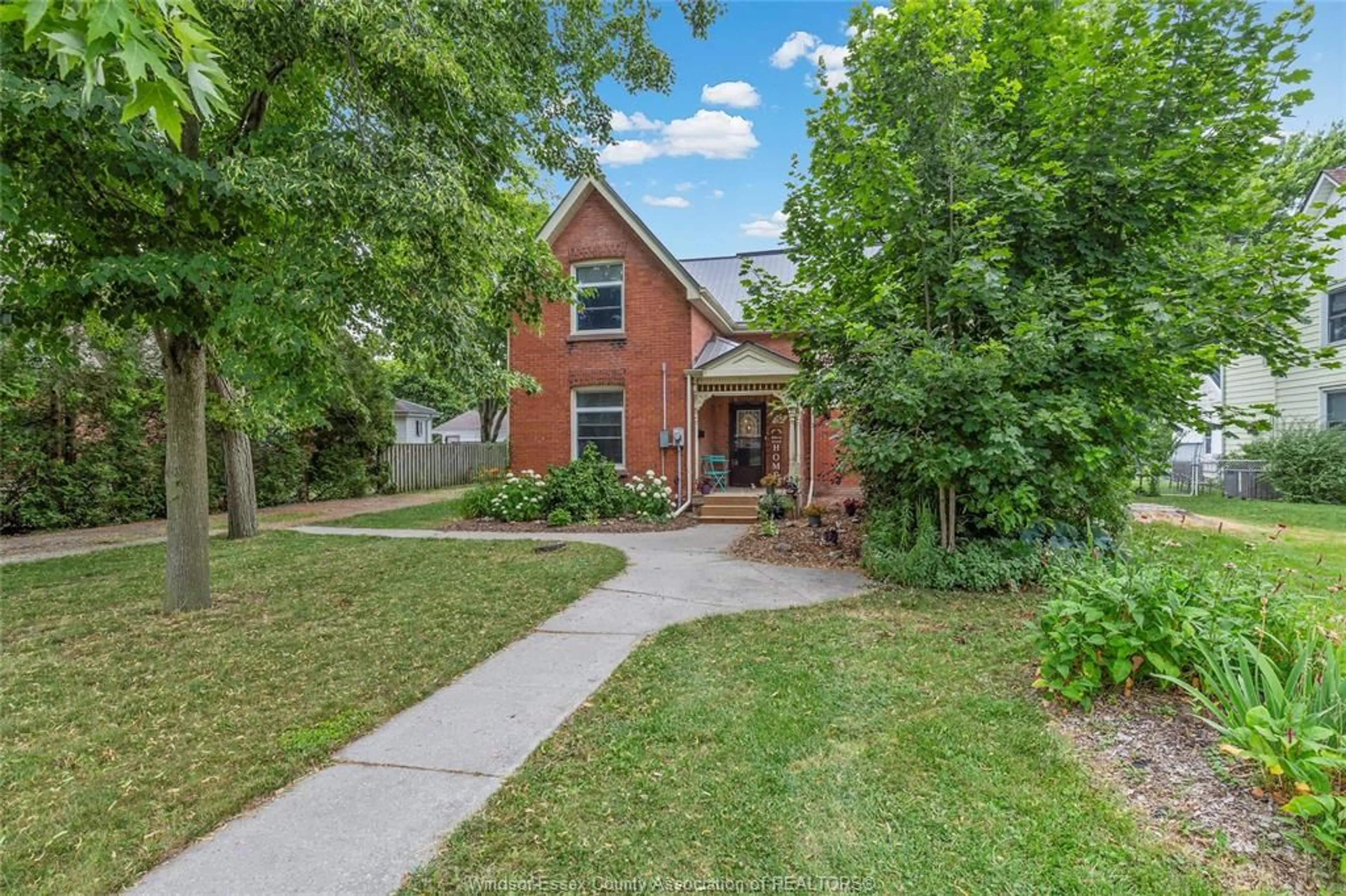 Home with brick exterior material, street for 32 CANAL St, Tilbury Ontario N0P 2L0