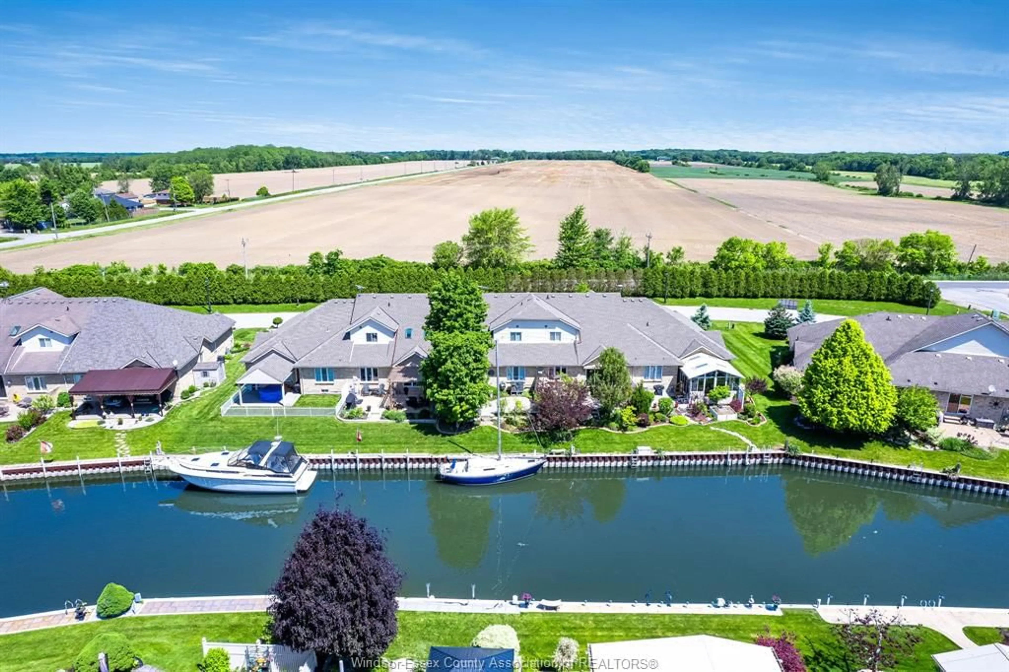 A pic from outside/outdoor area/front of a property/back of a property/a pic from drone, water/lake/river/ocean view for 9 Montego Bay Cres, Kingsville Ontario N9Y 4E7