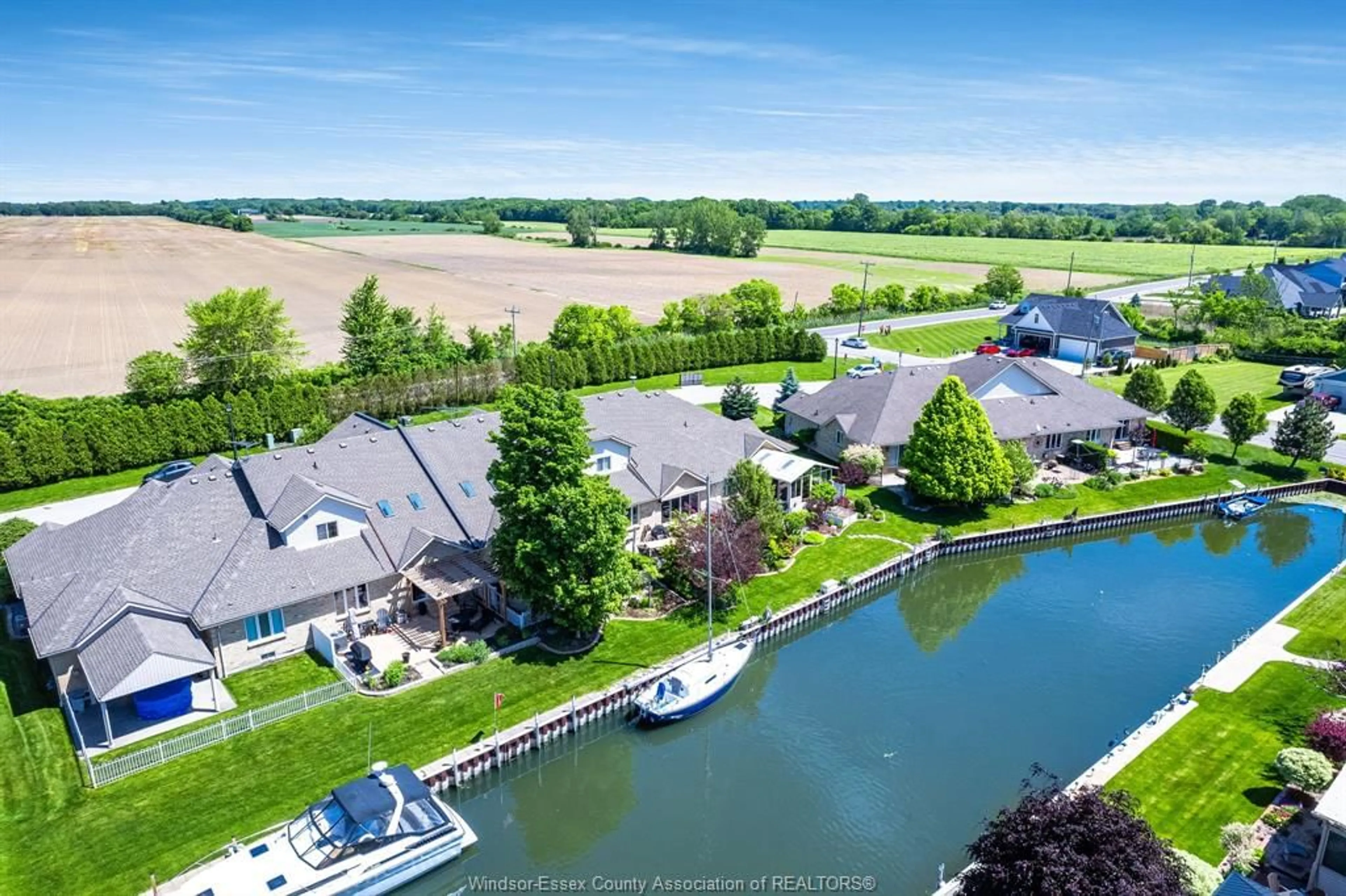 A pic from outside/outdoor area/front of a property/back of a property/a pic from drone, water/lake/river/ocean view for 9 Montego Bay Cres, Kingsville Ontario N9Y 4E7