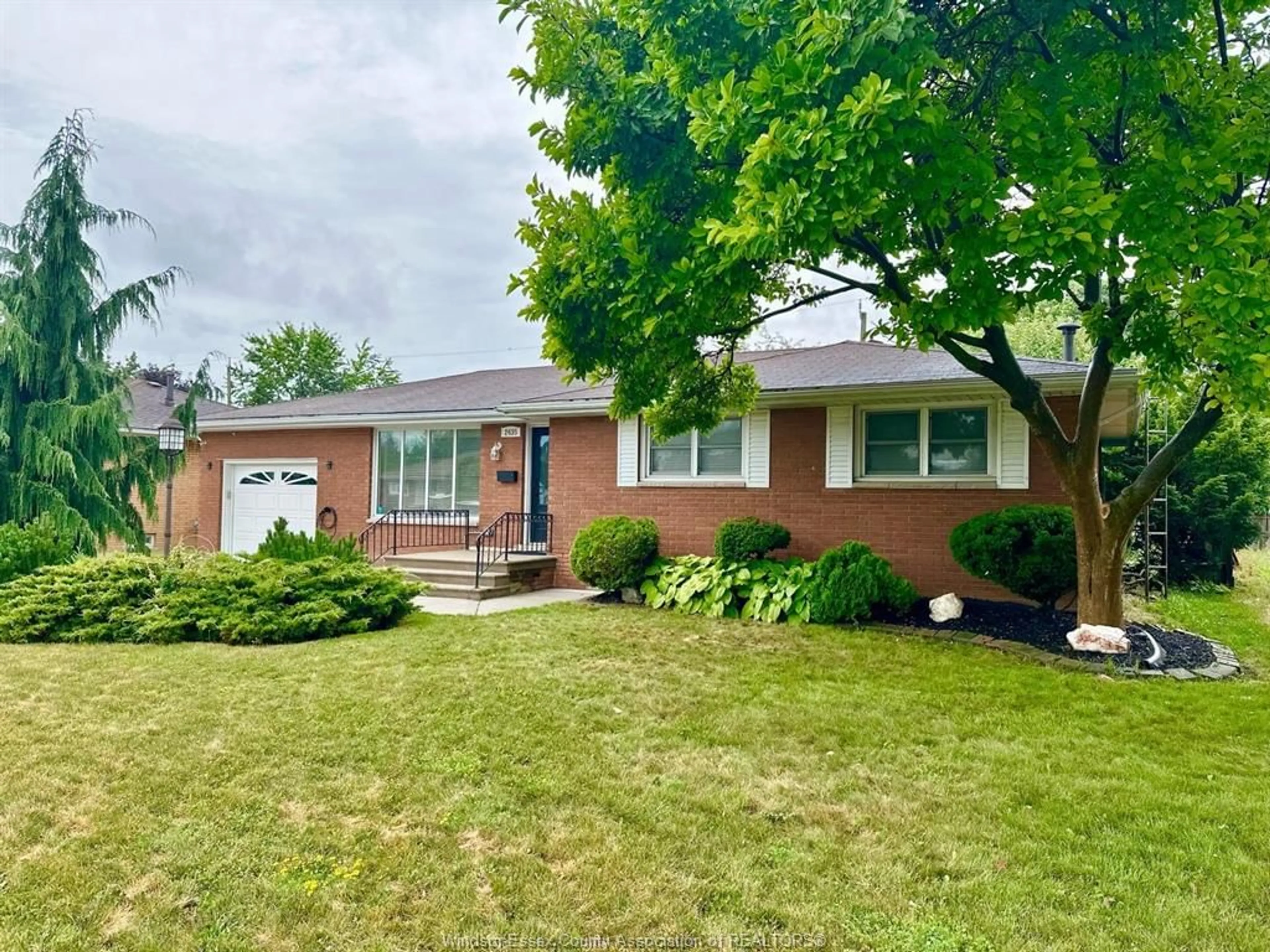 Home with brick exterior material, street for 2435 McKay Ave, Windsor Ontario N9E 2P4