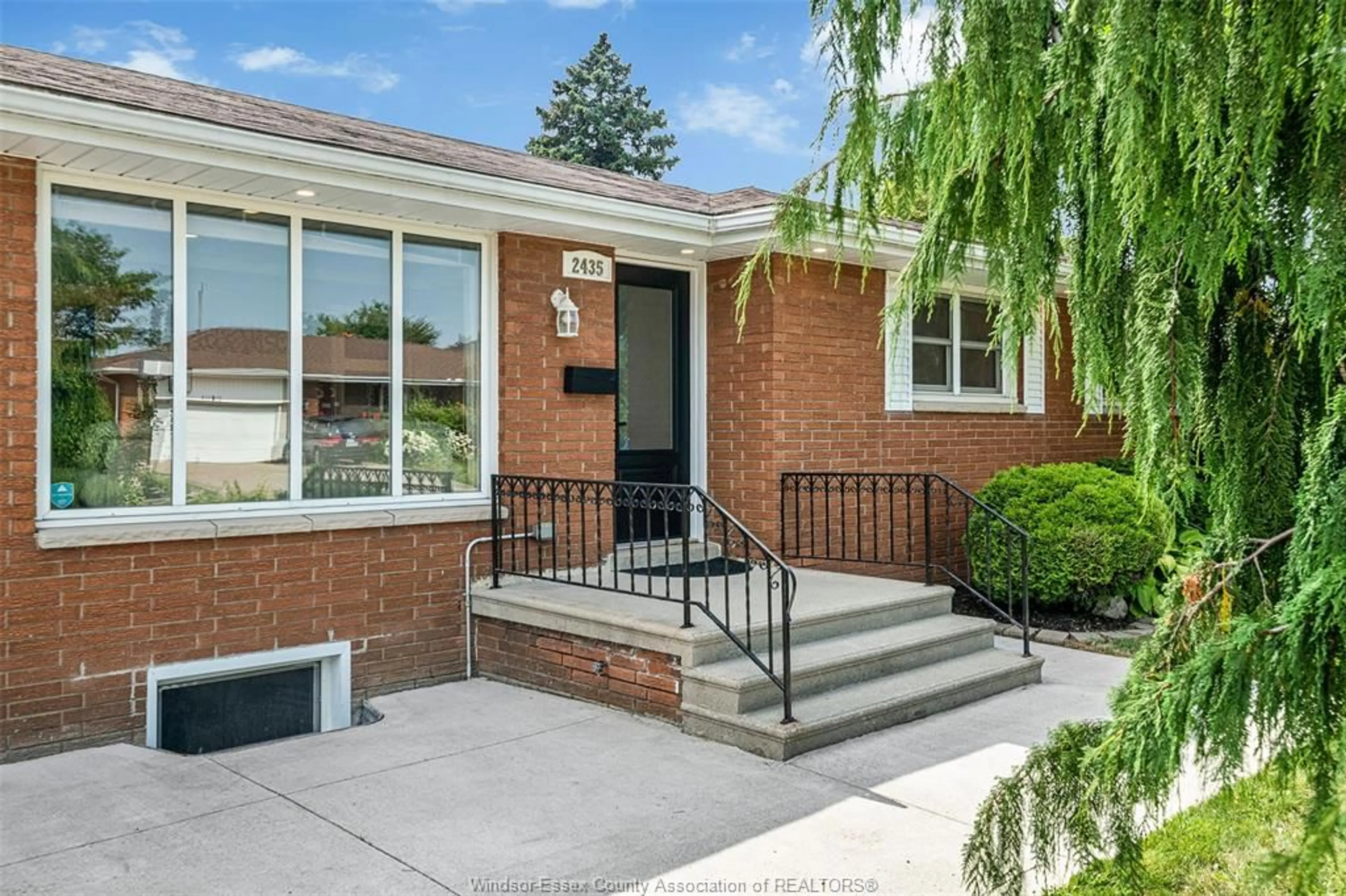 Home with brick exterior material, street for 2435 McKay Ave, Windsor Ontario N9E 2P4