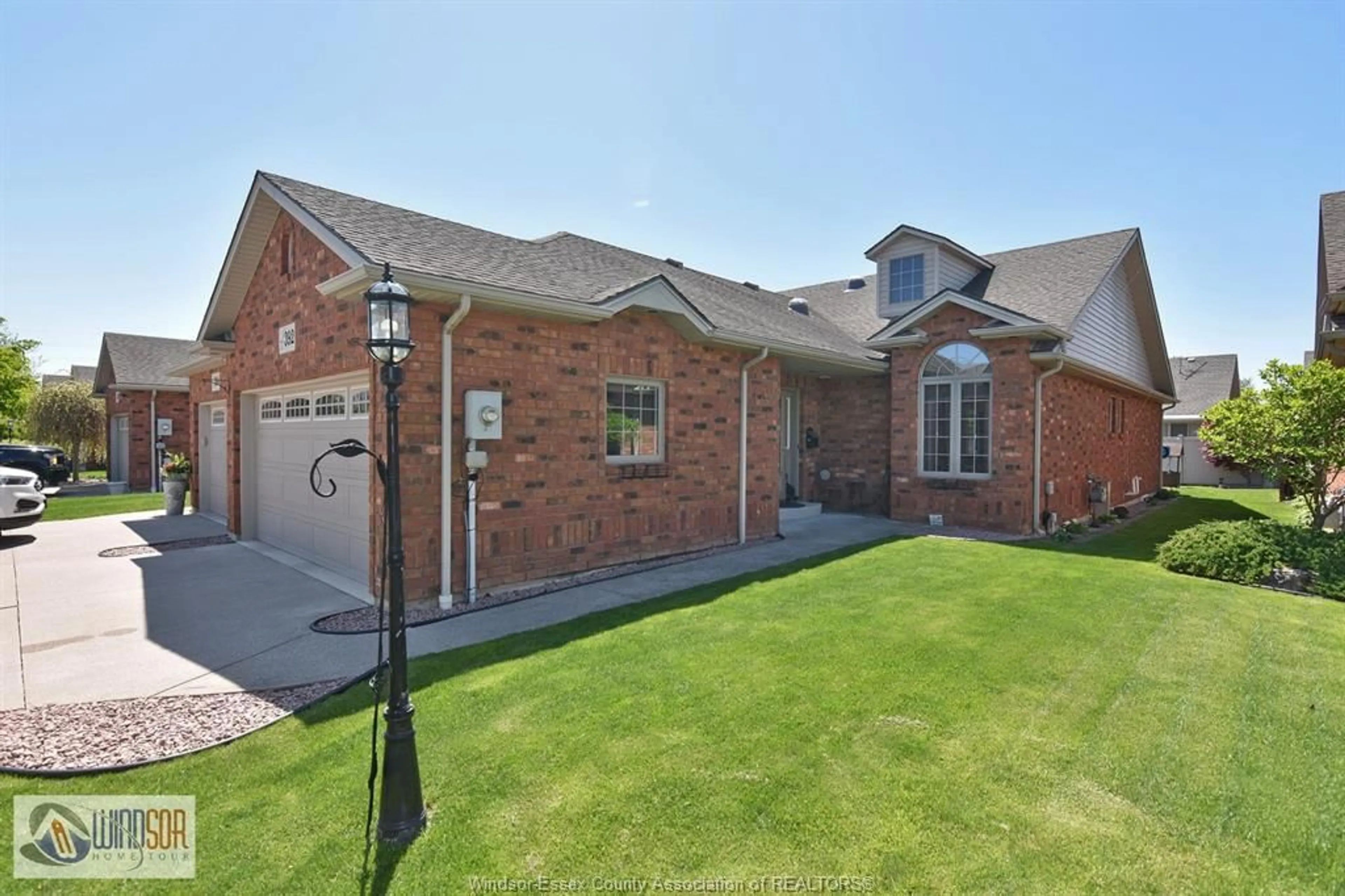 Home with brick exterior material, street for 392 MILLSTONE Lane, Lakeshore Ontario N0R 1A0