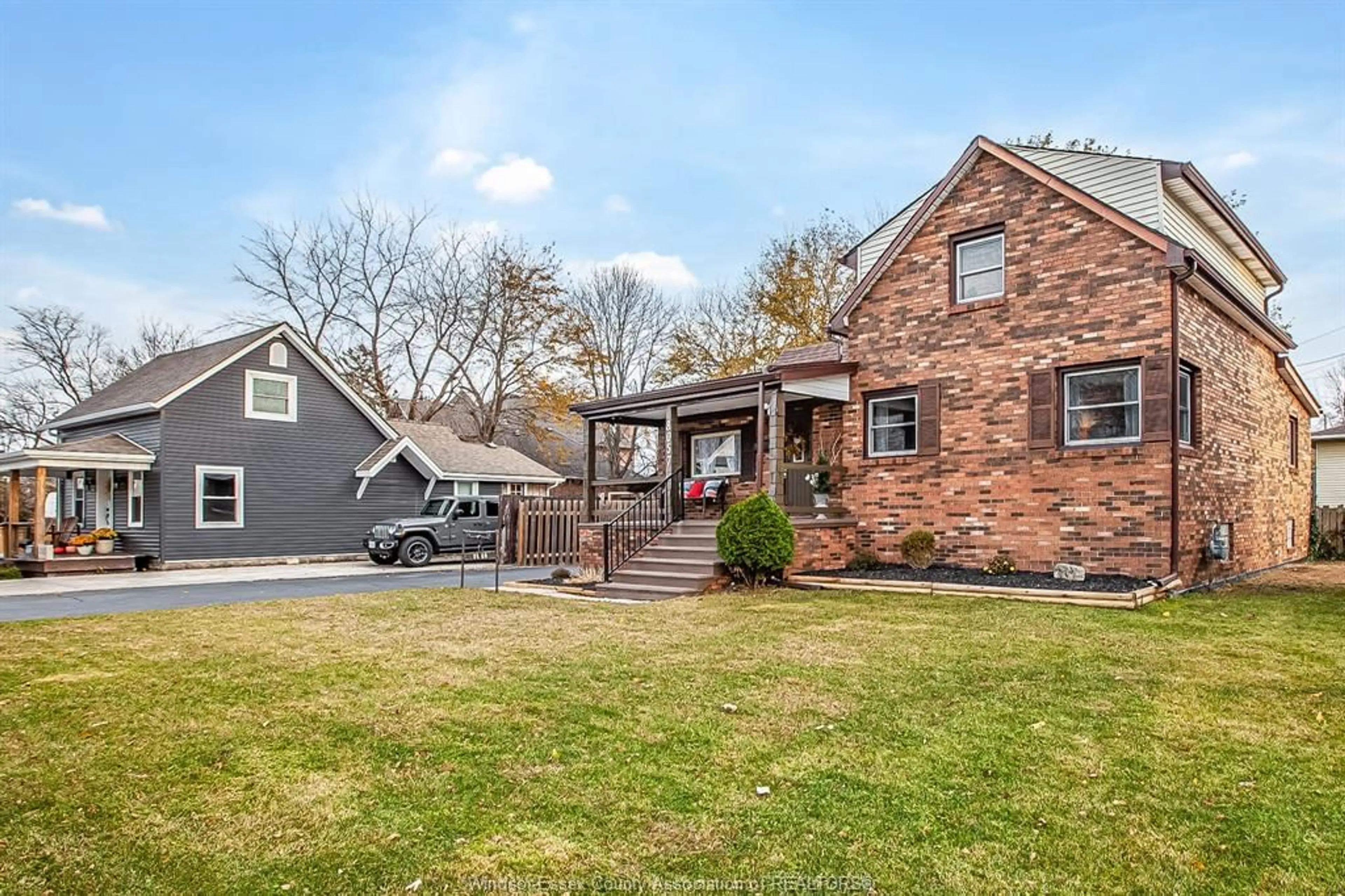 Home with brick exterior material, street for 8057 RIVERSIDE Dr, Windsor Ontario N8S 1E5