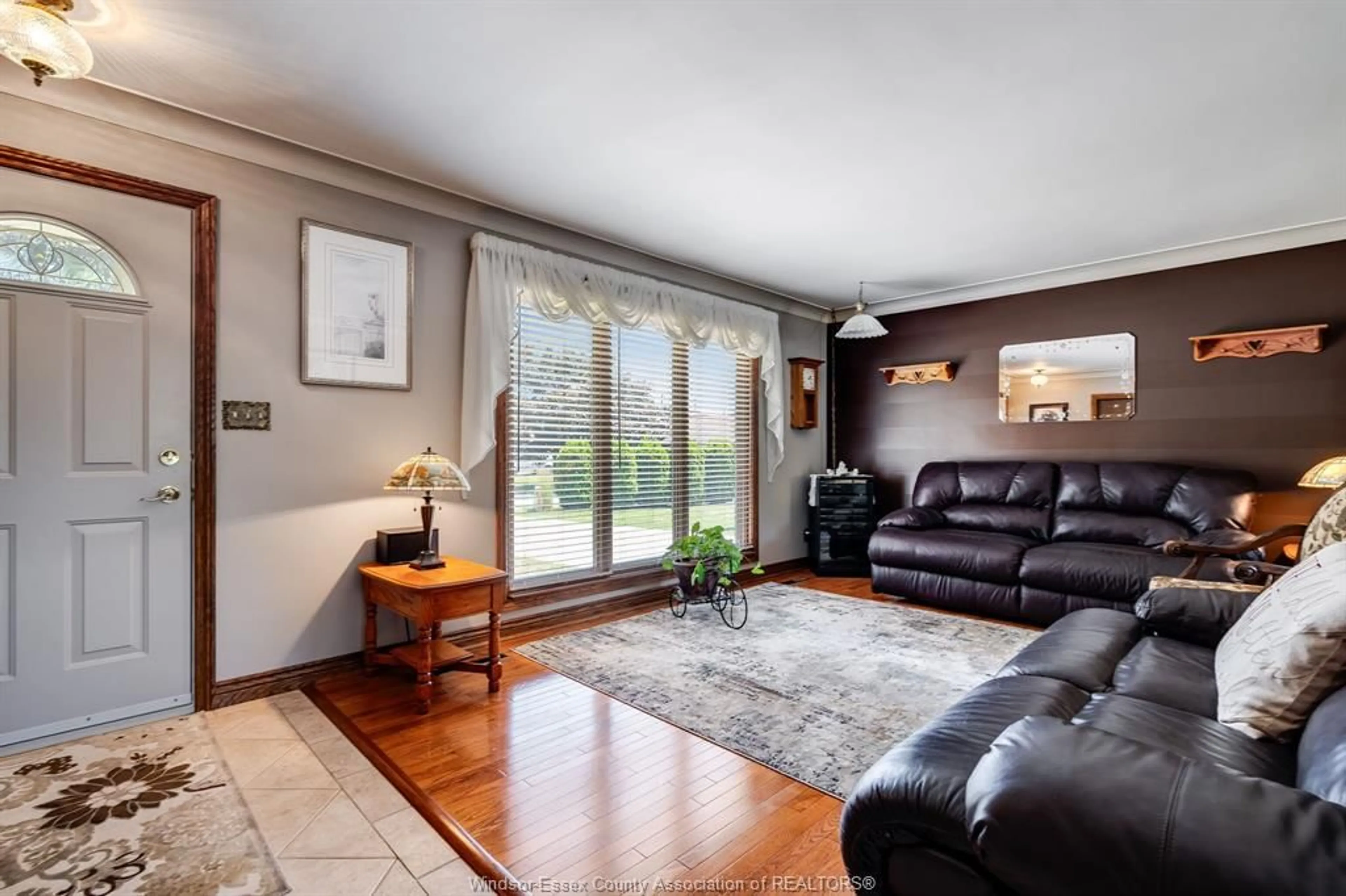 Living room with furniture, wood/laminate floor for 1845 Fairlea Cres, Kingsville Ontario N0P 2G0