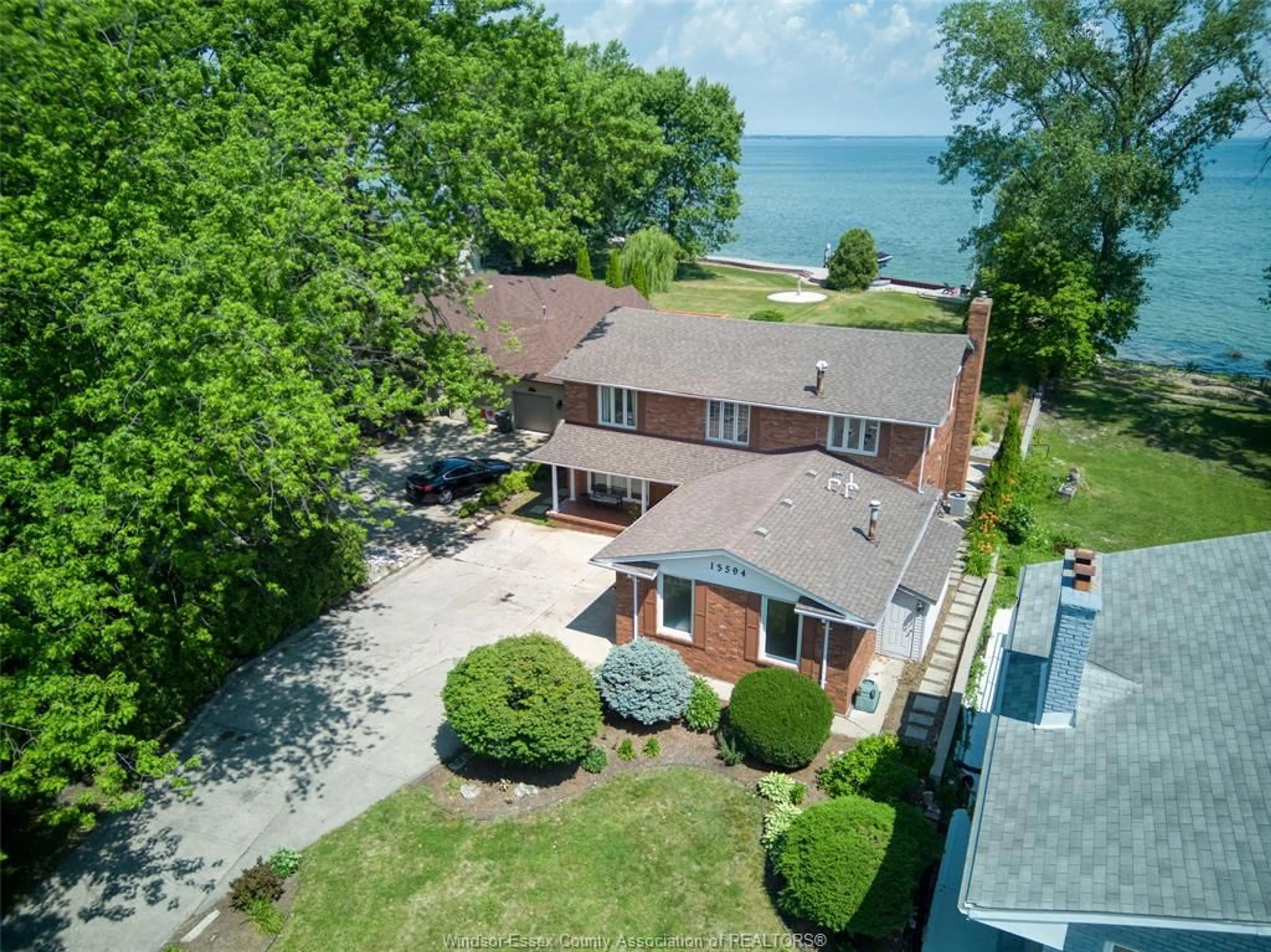 A pic from outside/outdoor area/front of a property/back of a property/a pic from drone, water/lake/river/ocean view for 13594 RIVERSIDE Dr, Tecumseh Ontario N8N 2M8