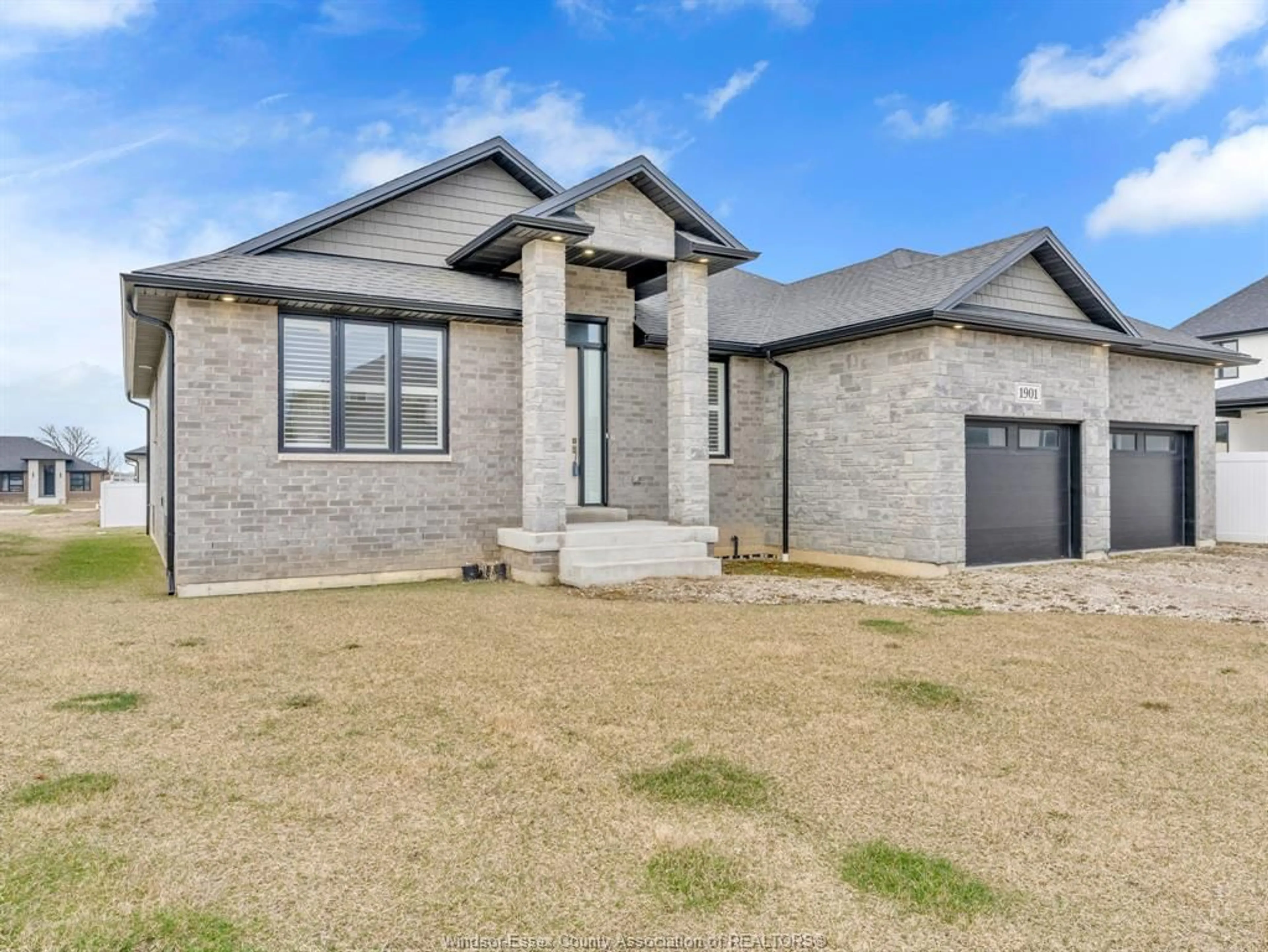 Home with brick exterior material, street for 1901 VILLA CANAL Dr, Kingsville Ontario N9Y 0G5
